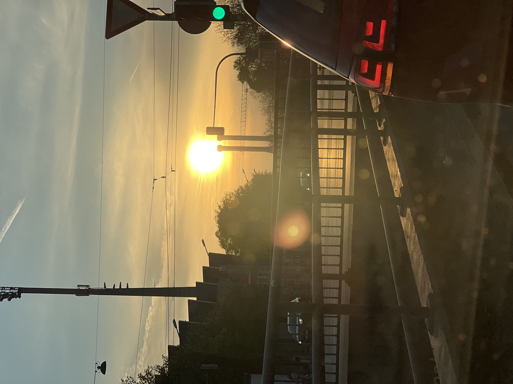 Sunset observed over Munich traffic intersection Saturday evening