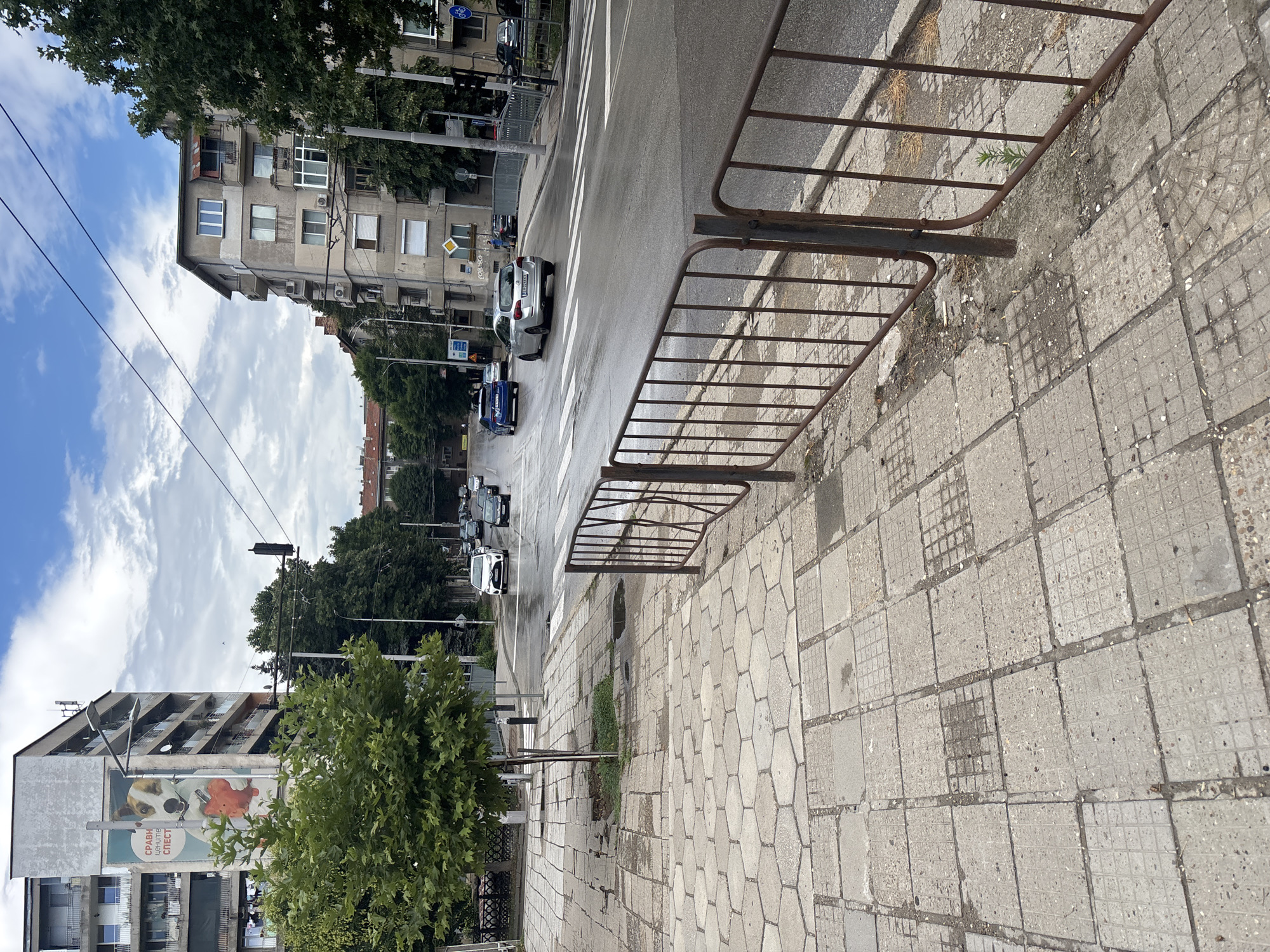 Rainy afternoon in Pleven: city streets, stormy skies, gym stop