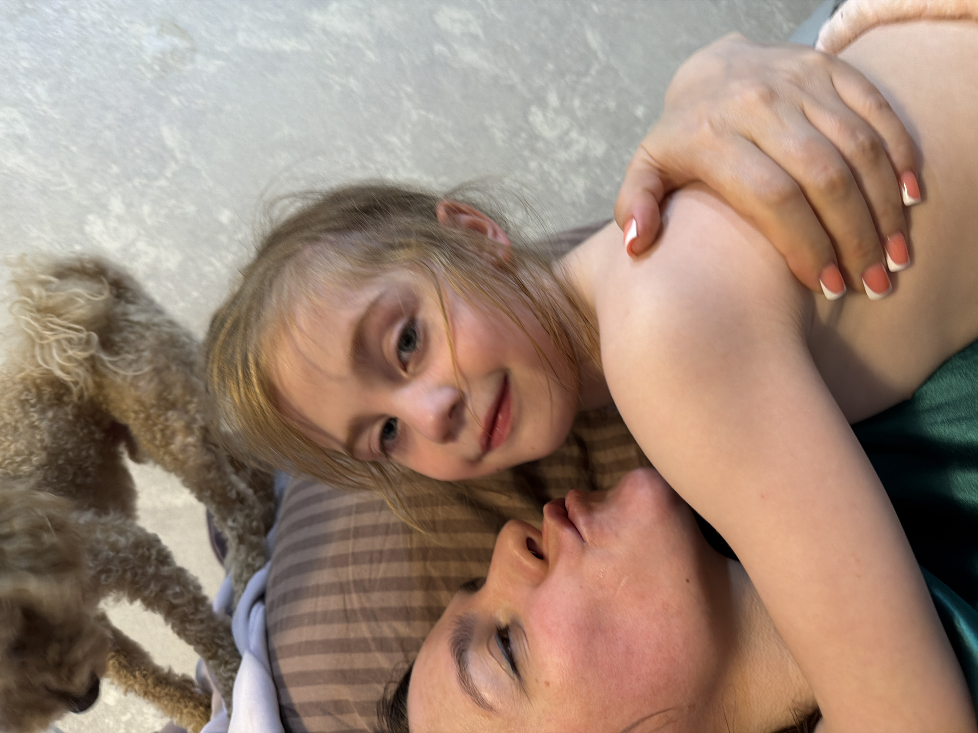 Lazy afternoon at home with a poodle, a cat, and kids