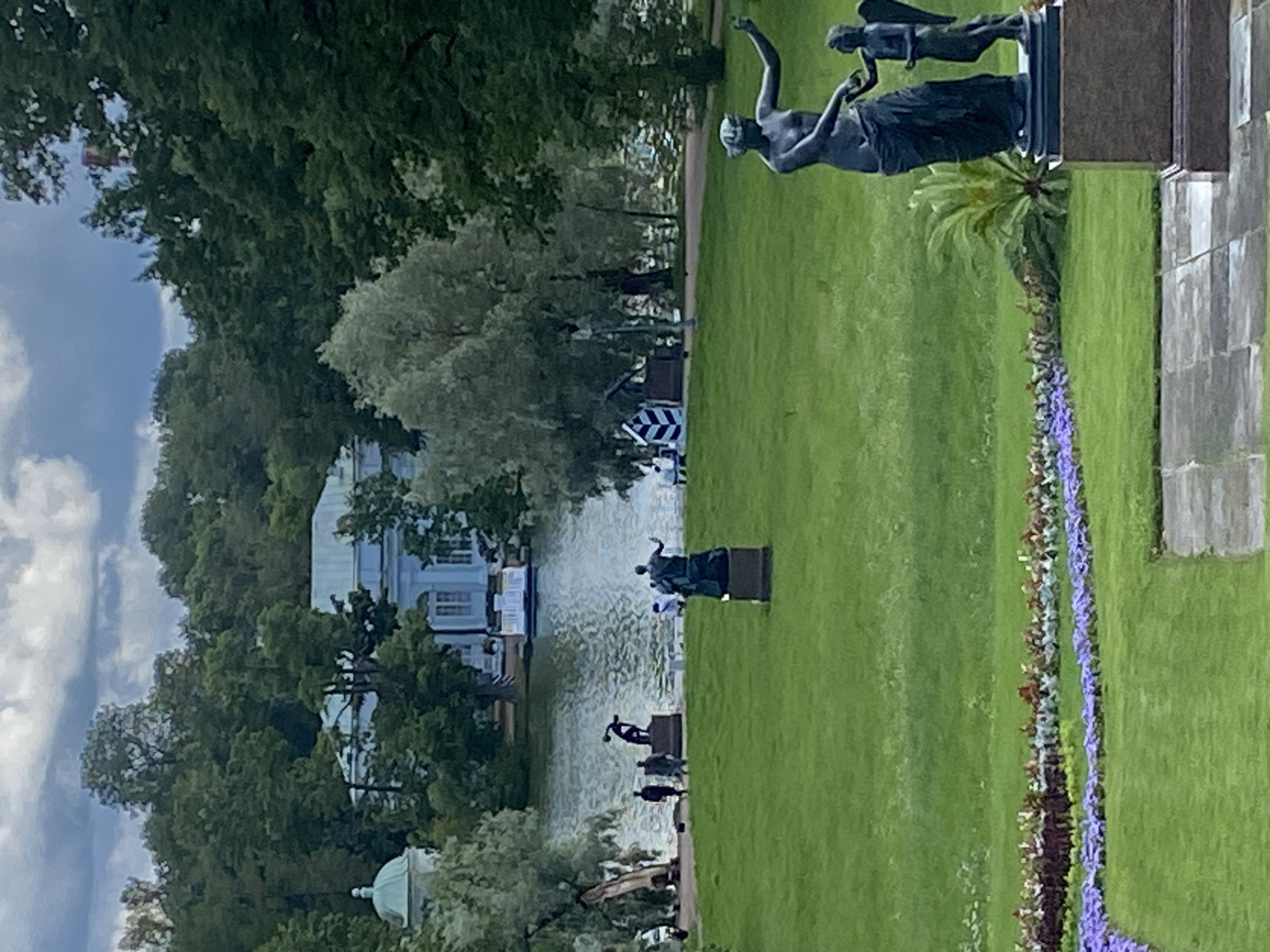 Pavlovsk Park's bronze statues and summer gardens in full bloom