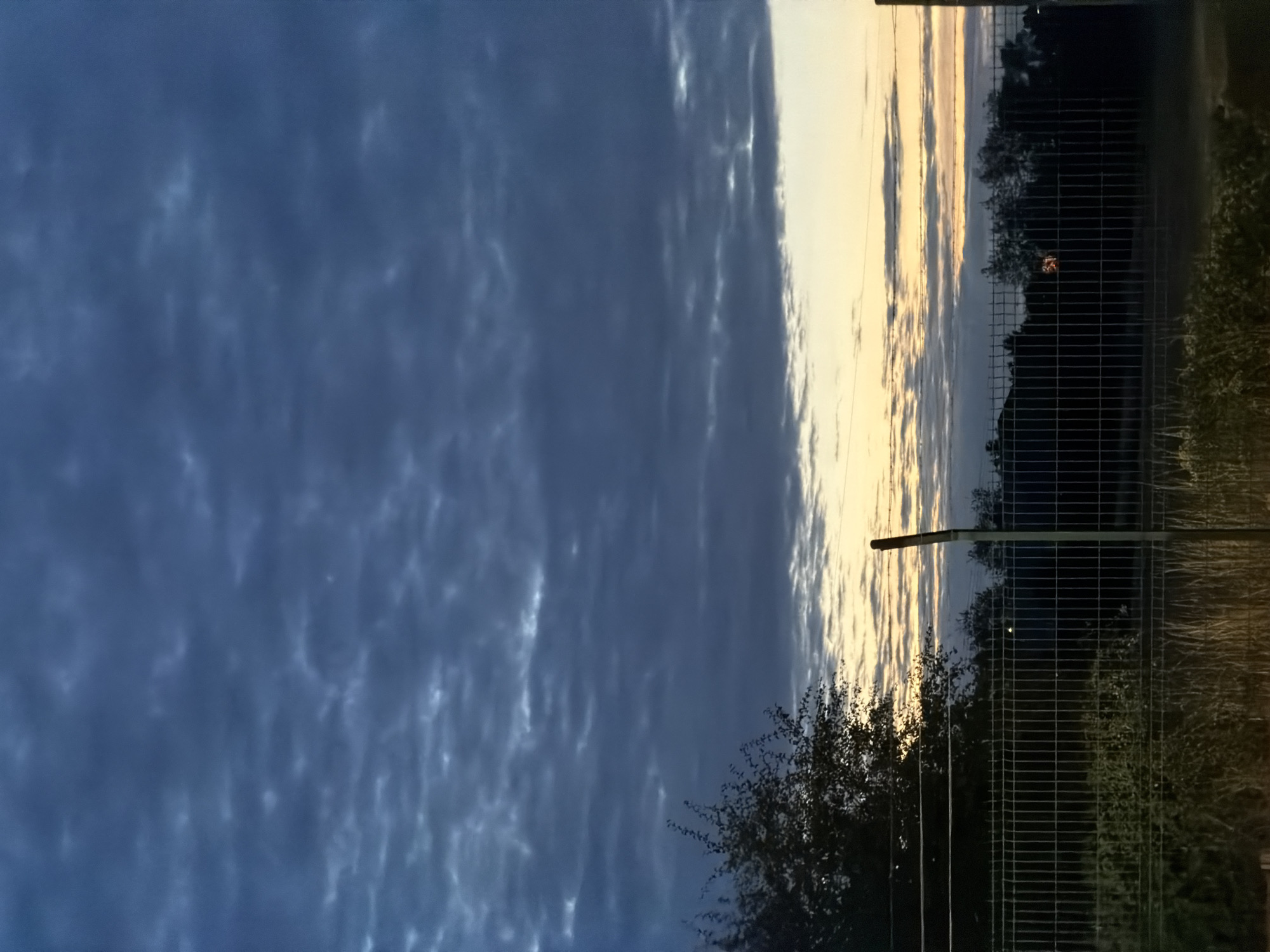 Twilight sky over Luxembourg, barbed wire and open horizon