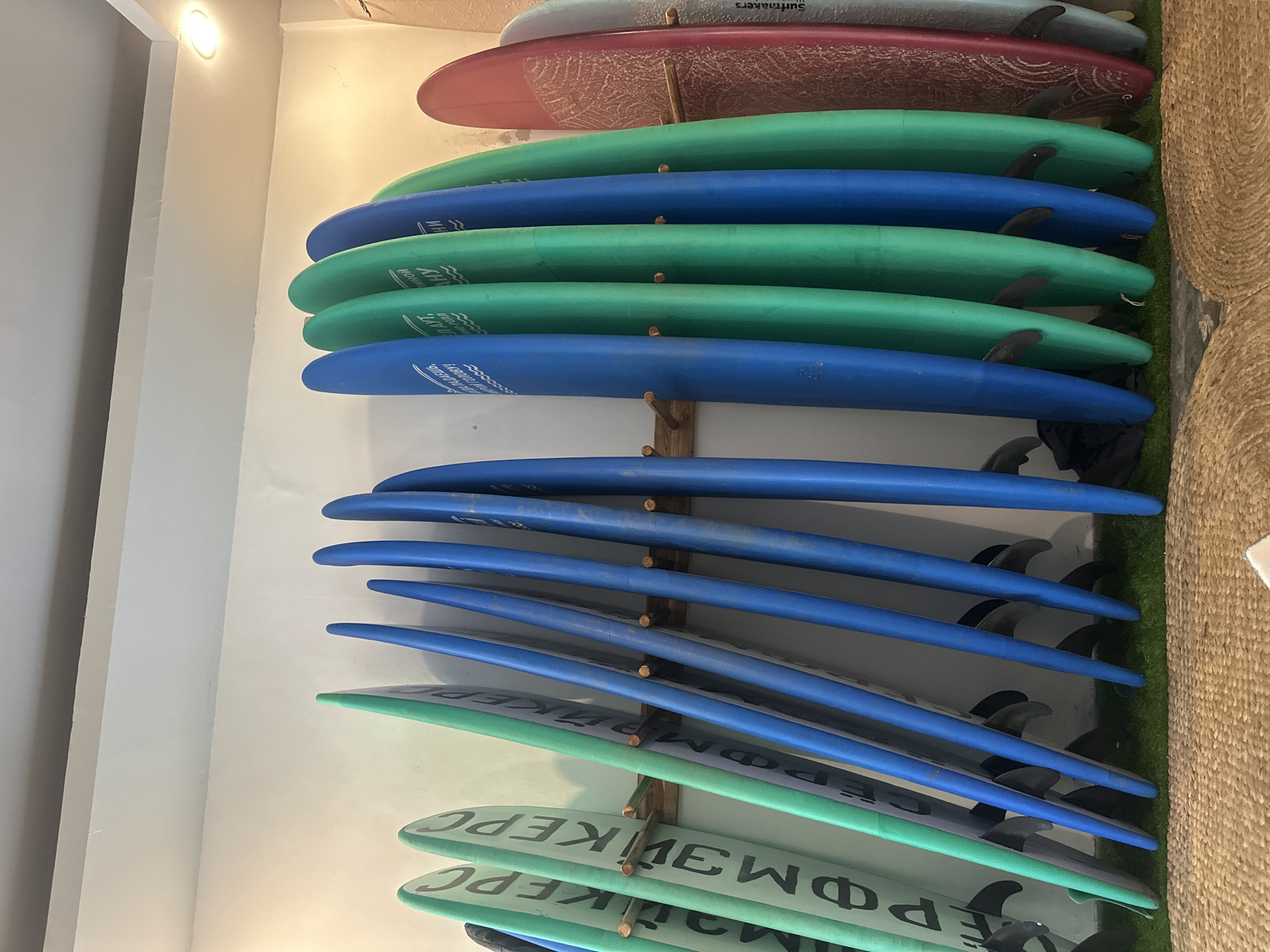 Surfboards stored at indoor facility in Kuta, Indonesia