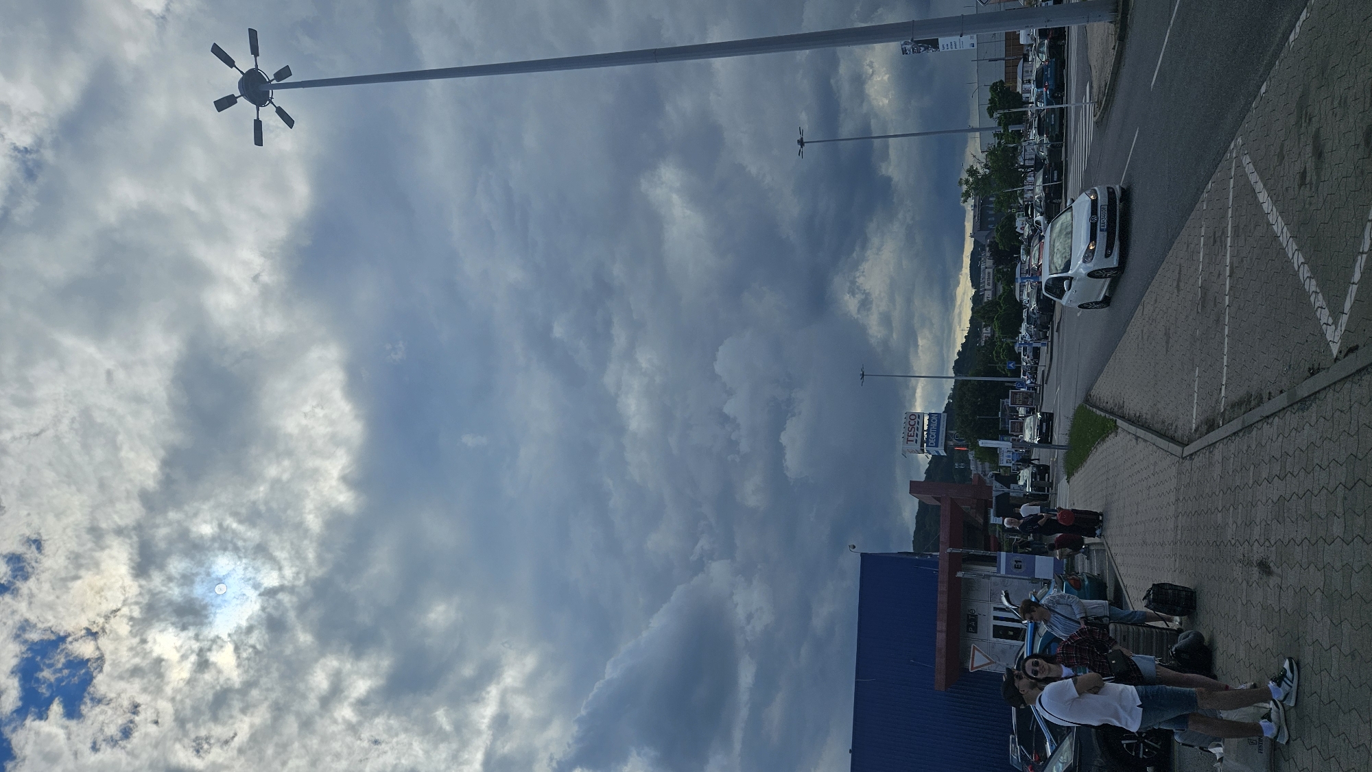Tour group boards buses at Prešov shopping center