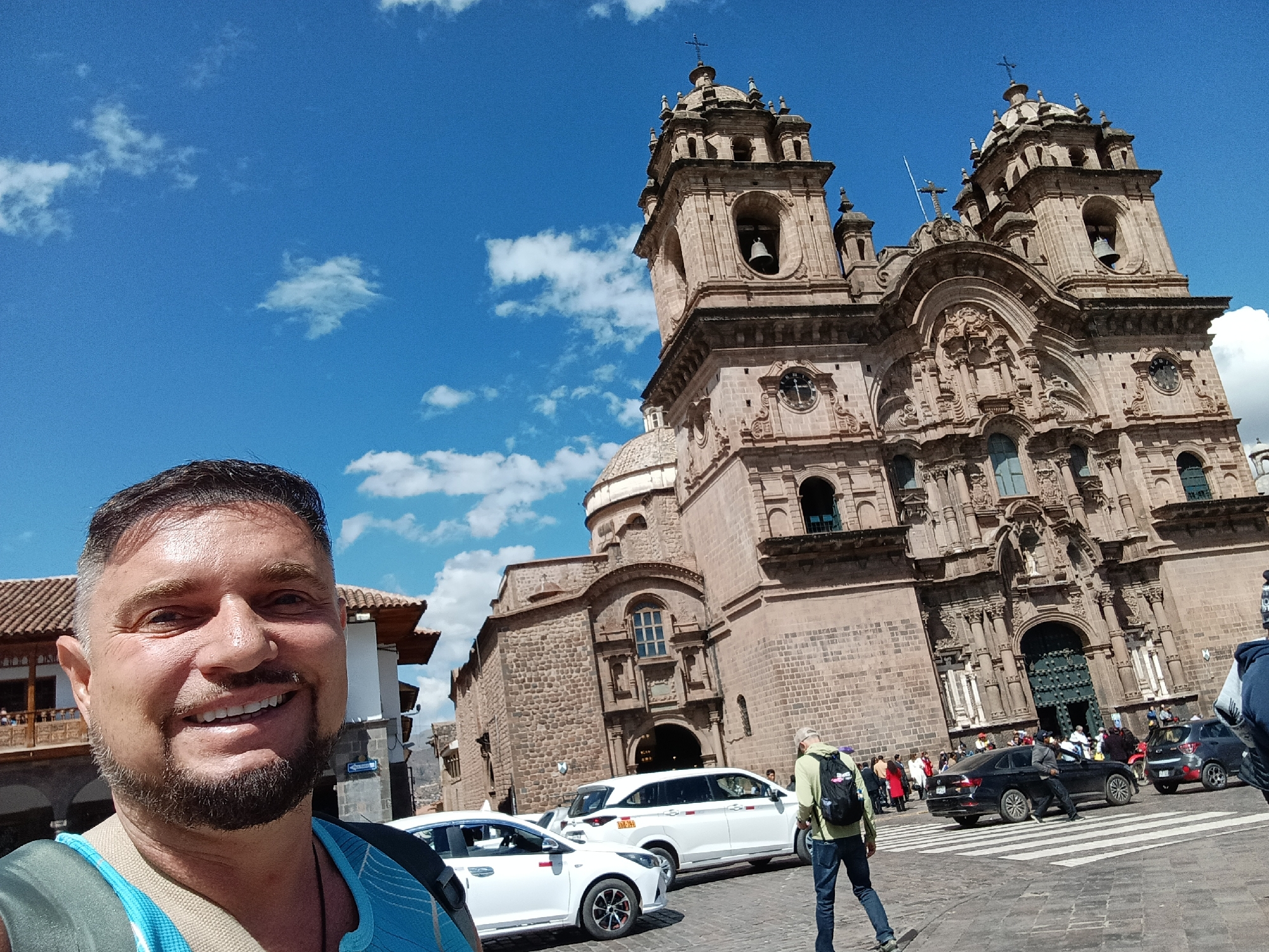 Tourist captures selfies at historic Plaza de Armas, Cusco