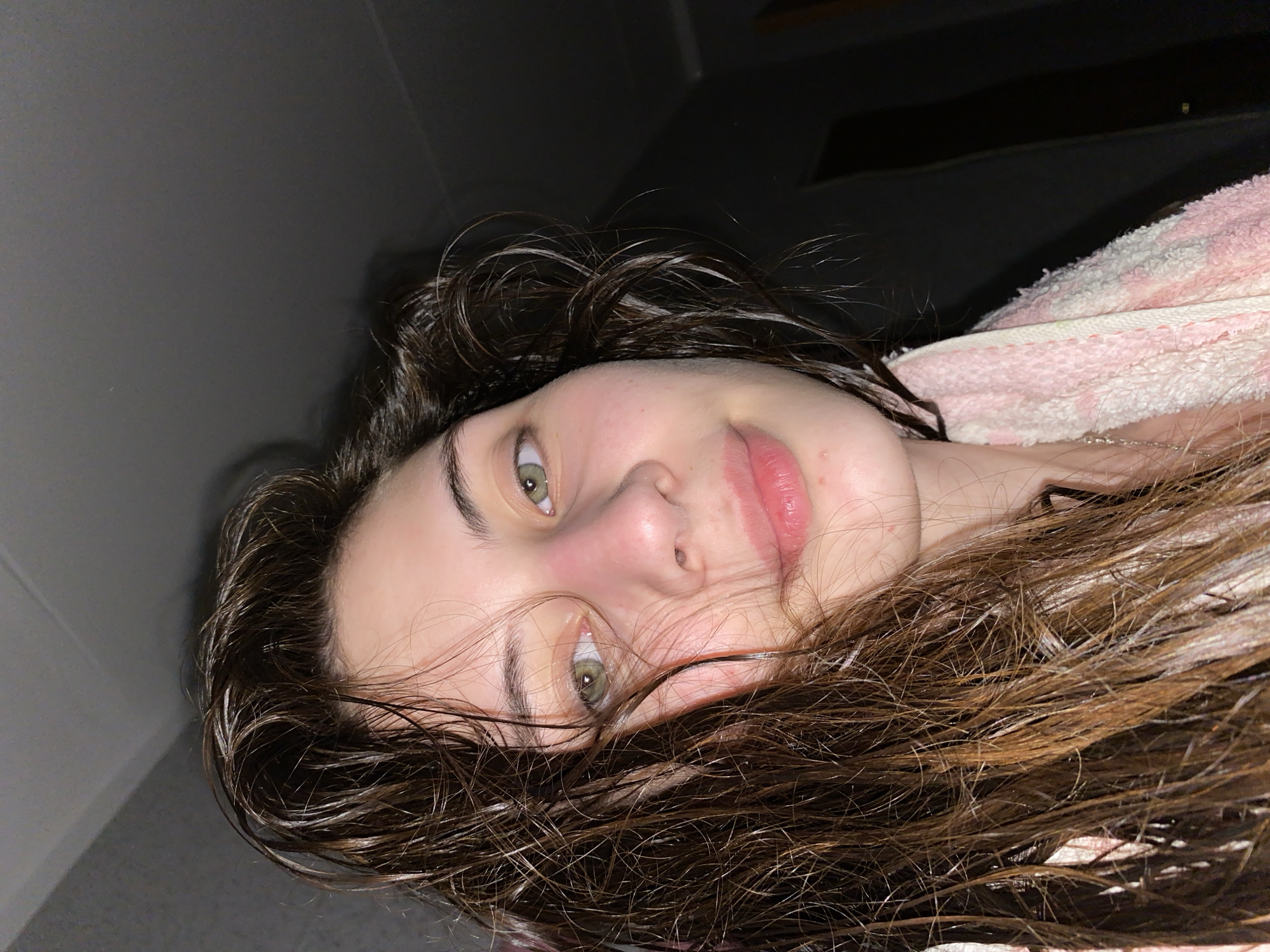 Woman with wet hair photographed in casual moments, Votkinsk