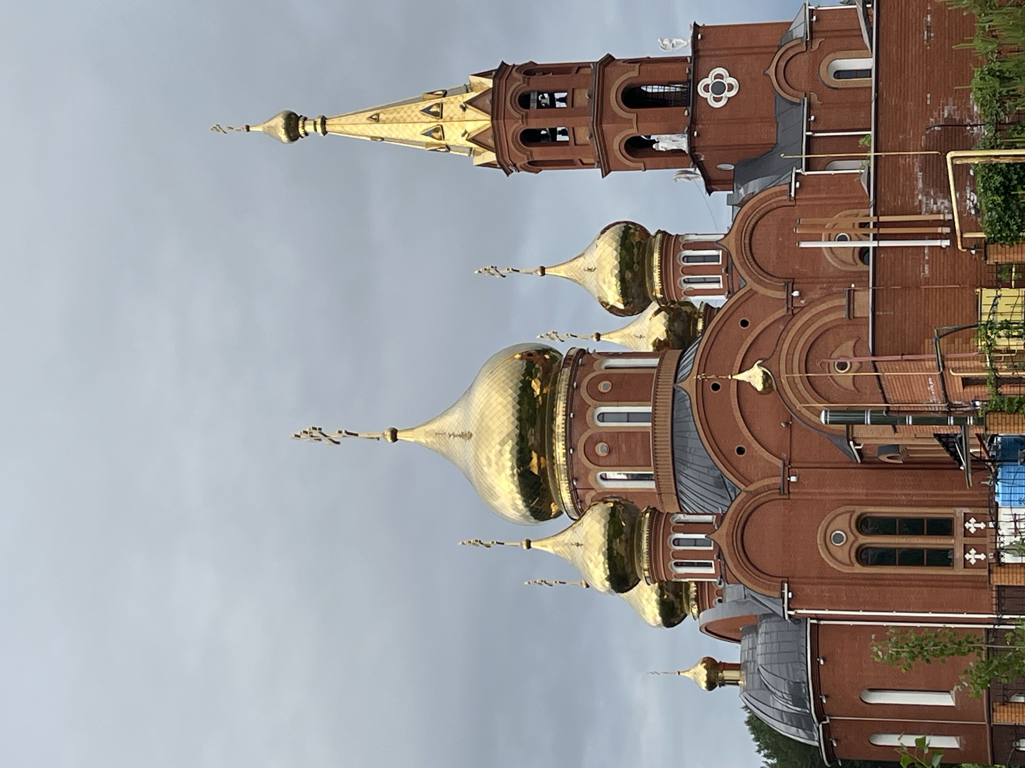 Early morning cyclist spotted near Orthodox church in Chaikovsky