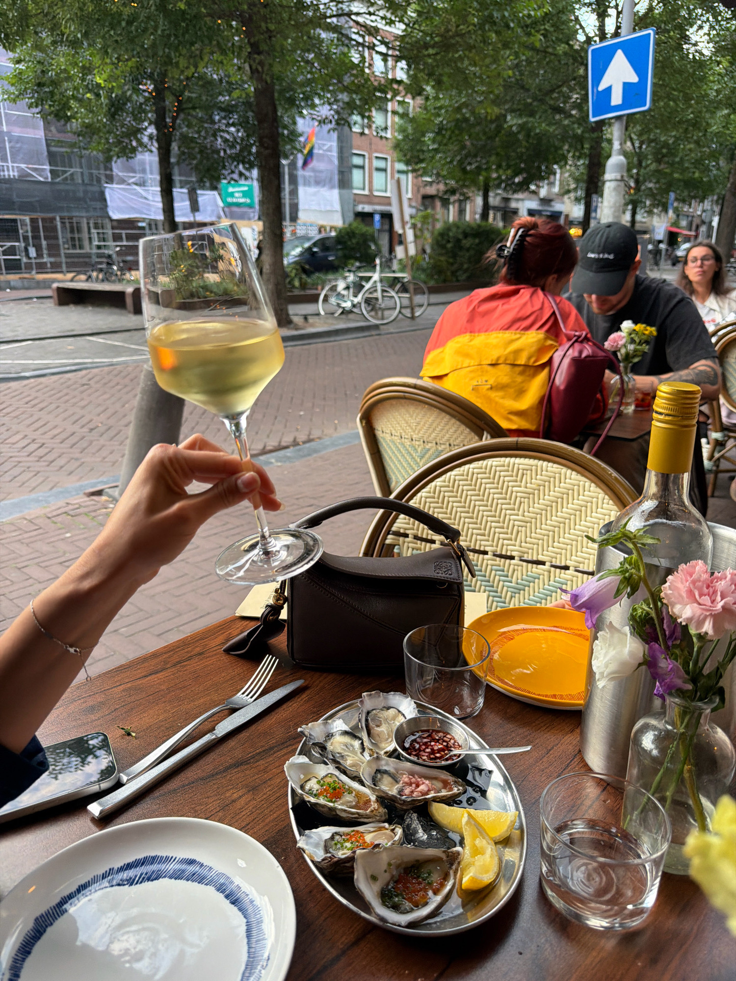 Oysters and wine at a table in Amsterdam