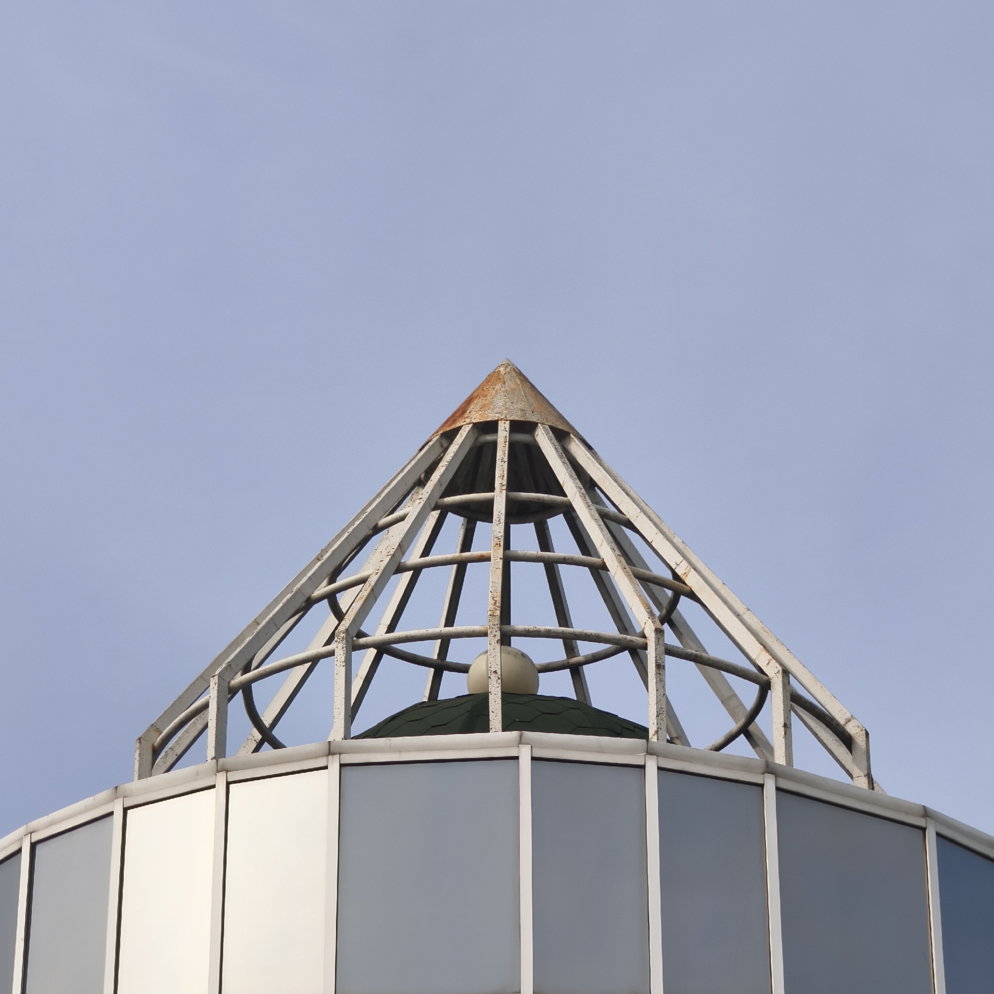 Metal pyramid structure documented atop building in Hrodna