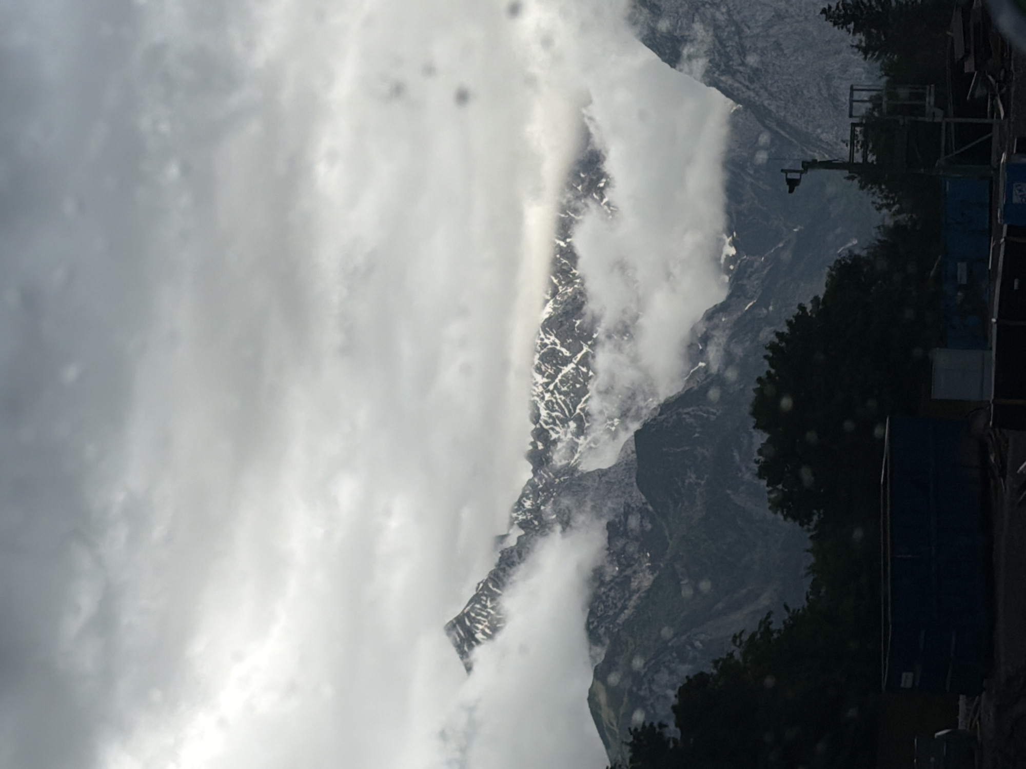 Snow-capped mountains observed through clouds near Garmisch-Partenkirchen