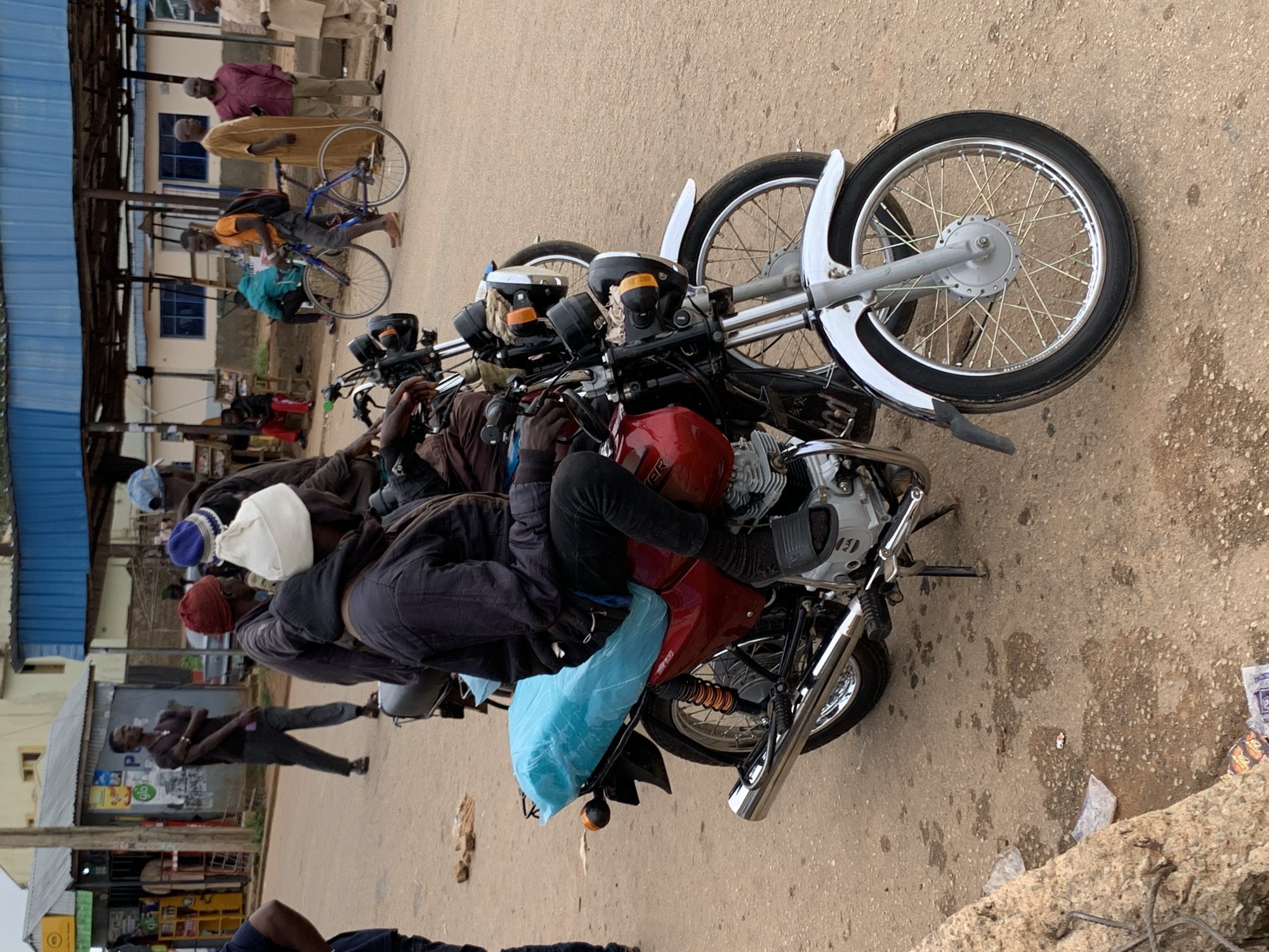 Street life and motorcycle traffic in Gura Top, Nigeria
