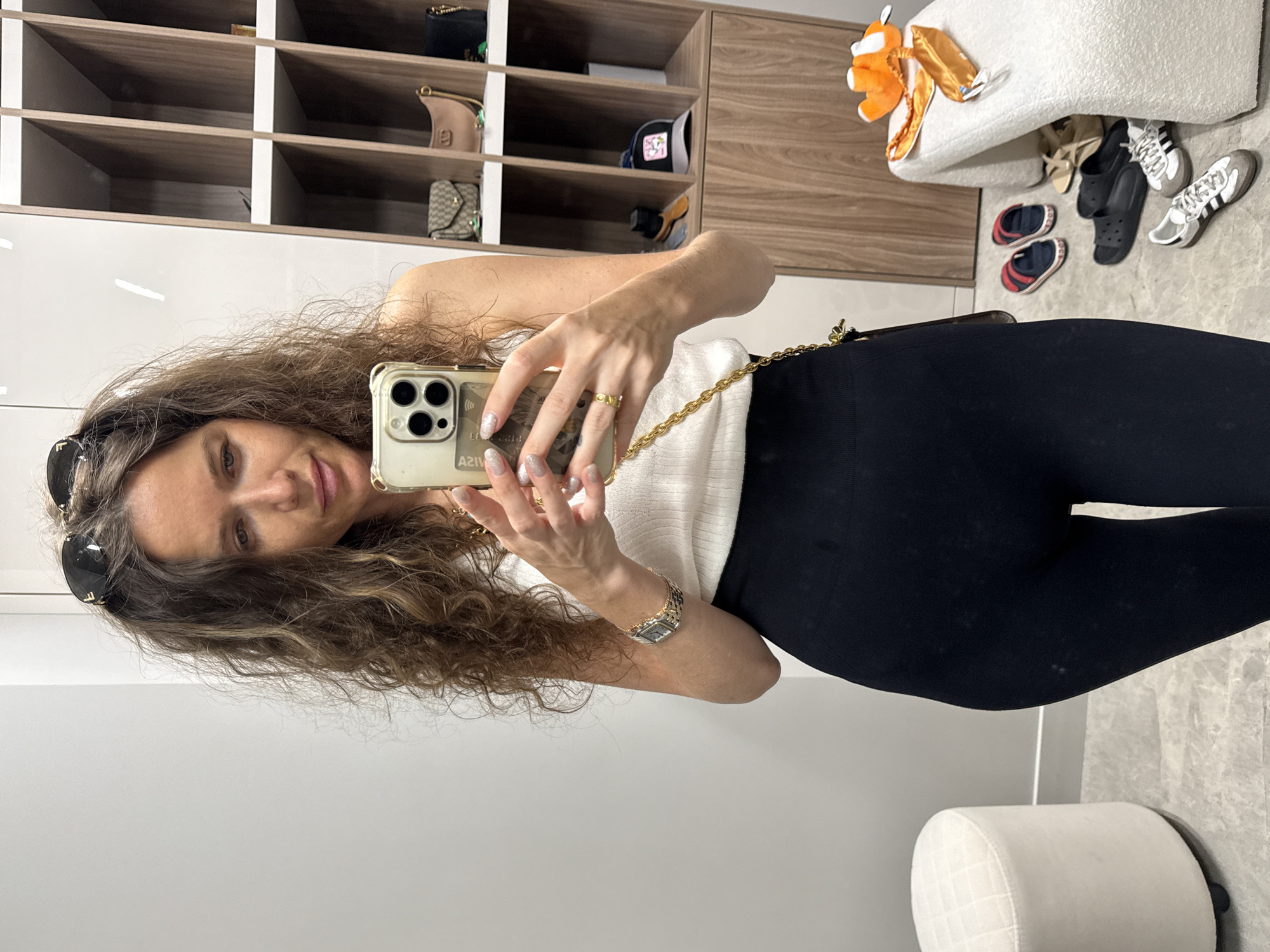 Woman takes mirror selfies in dressing room area