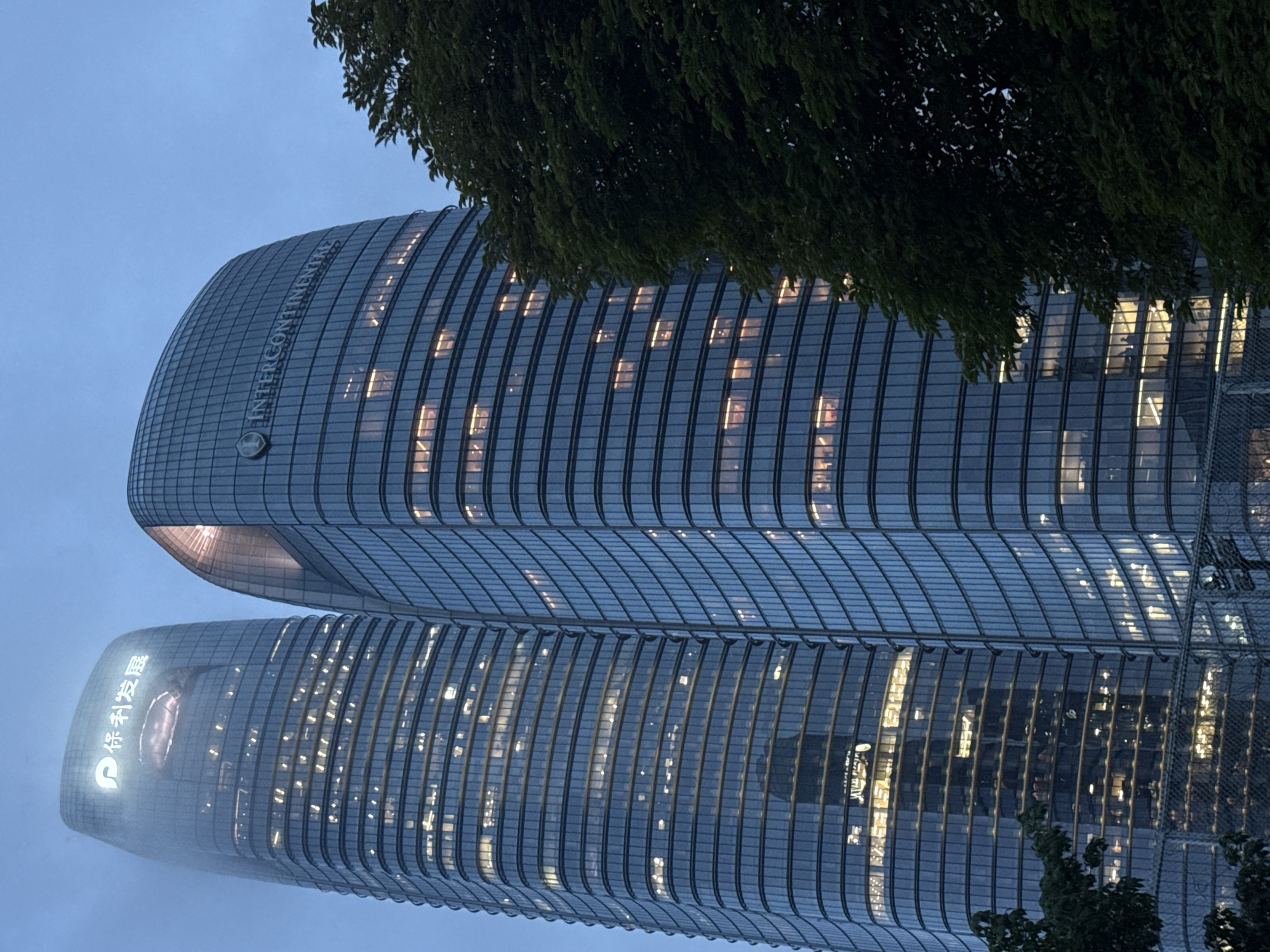 Haizhu District waterfront at dusk, towers lit along the Pearl River