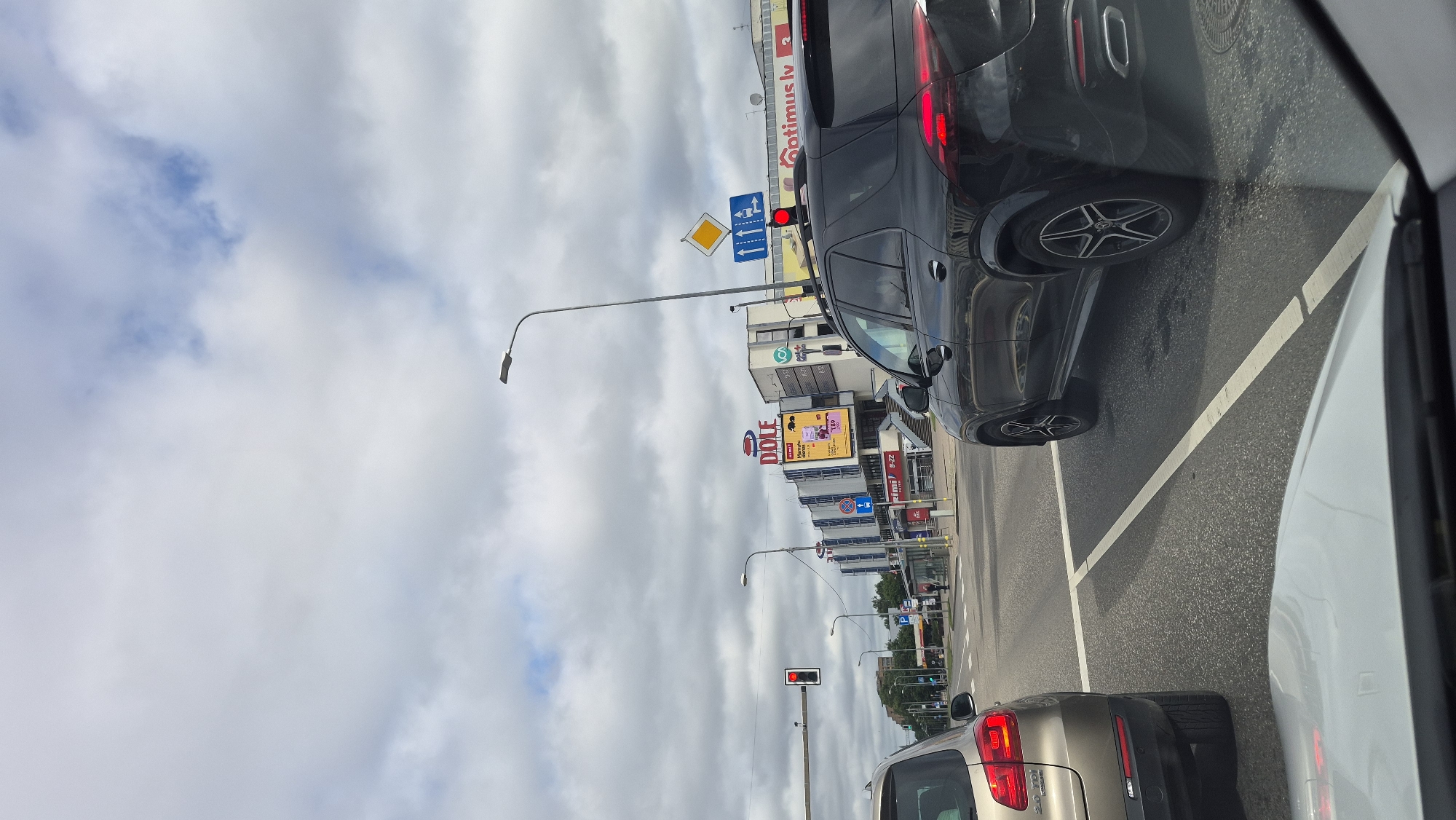 Bolt vehicles lined up on a Riga street on a grey morning