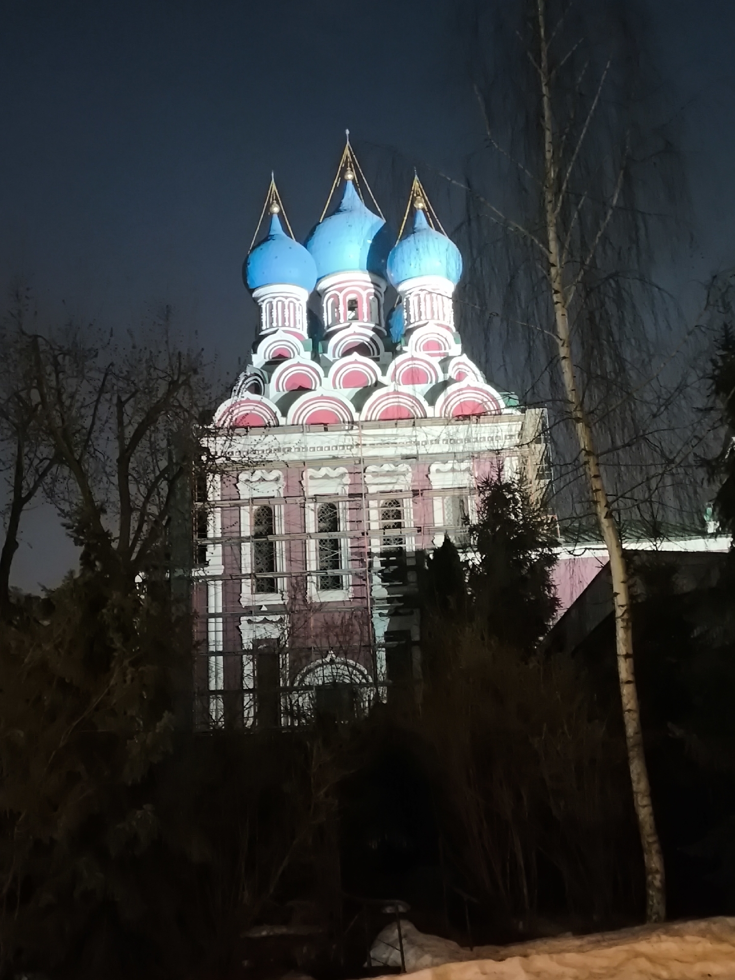 Moscow church illuminated at night with blue lighting