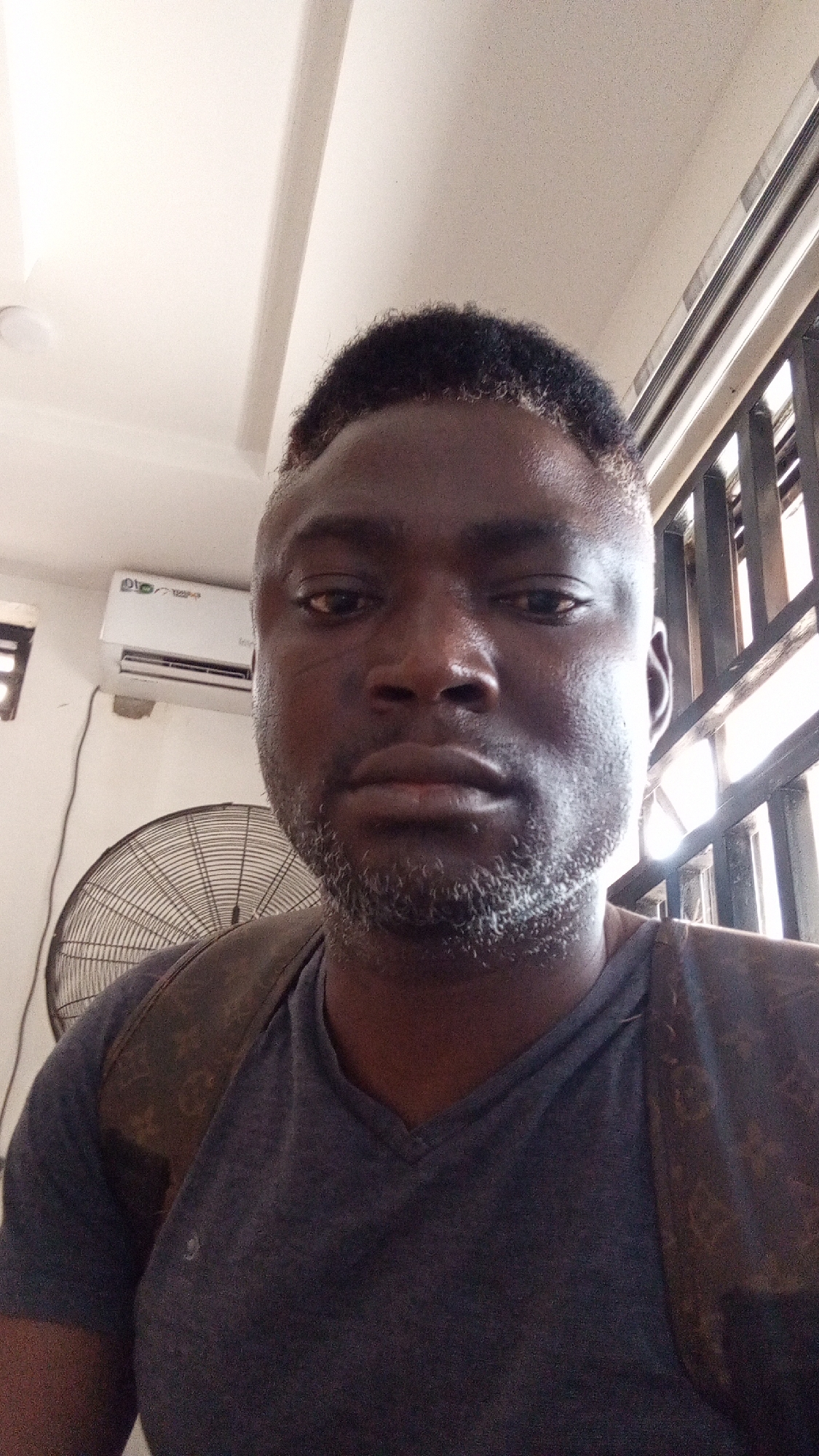 Man photographs camera equipment at electronics store in Nigeria