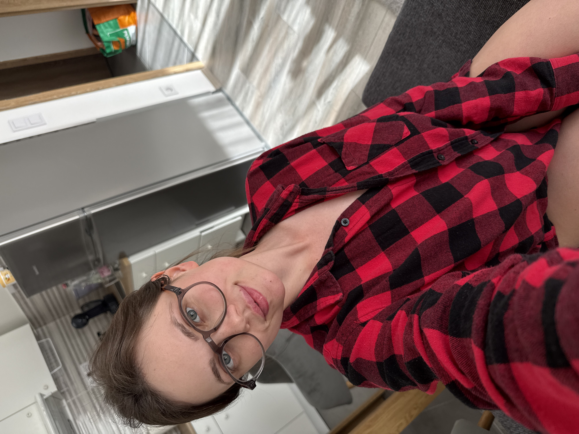 Woman takes kitchen selfie in Balatonlelle, Hungary