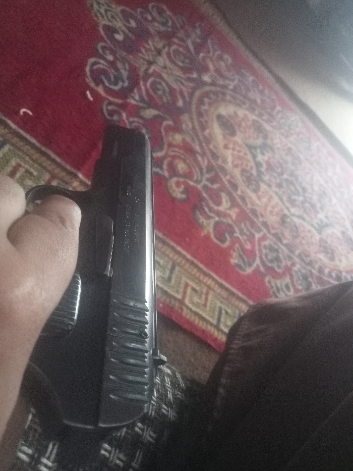 Firearm handling and disassembly documented in Mansehra, Pakistan