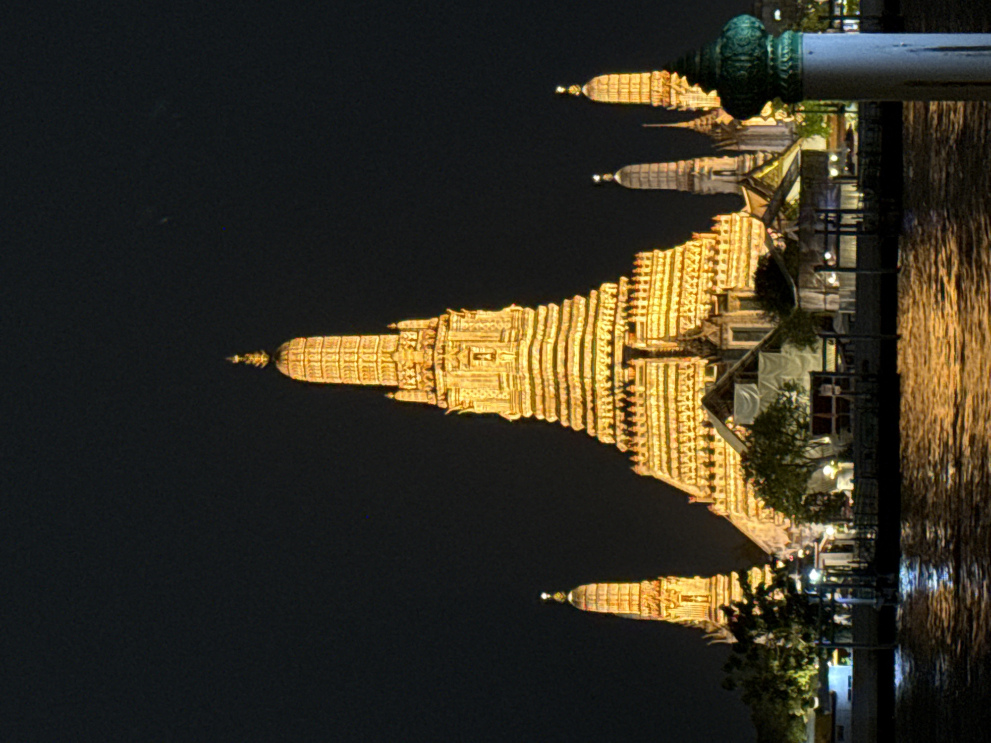 Wat Arun's towering prang glows after dark in Bangkok