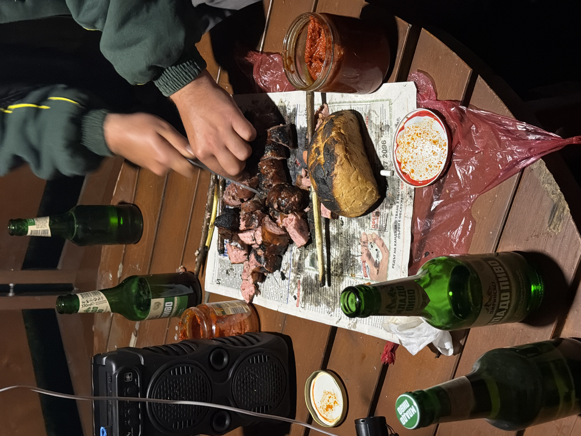 Evening campfire gathering in Tutrakantsi, Bulgaria draws social group