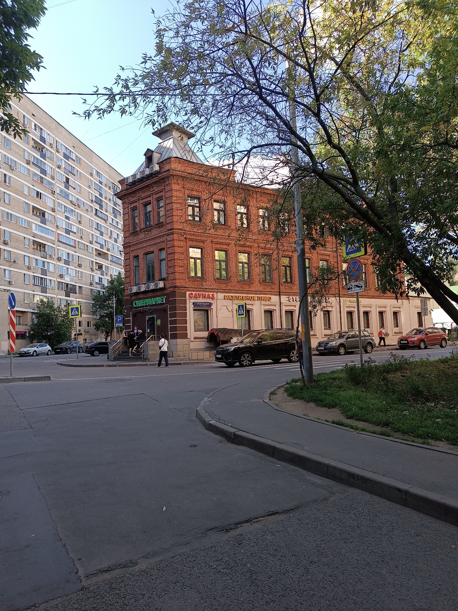 Moscow street scene: trams, apartment blocks, summer morning