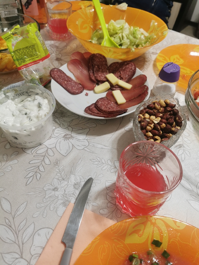 Group dining event at Plovdiv restaurant with charcuterie spread
