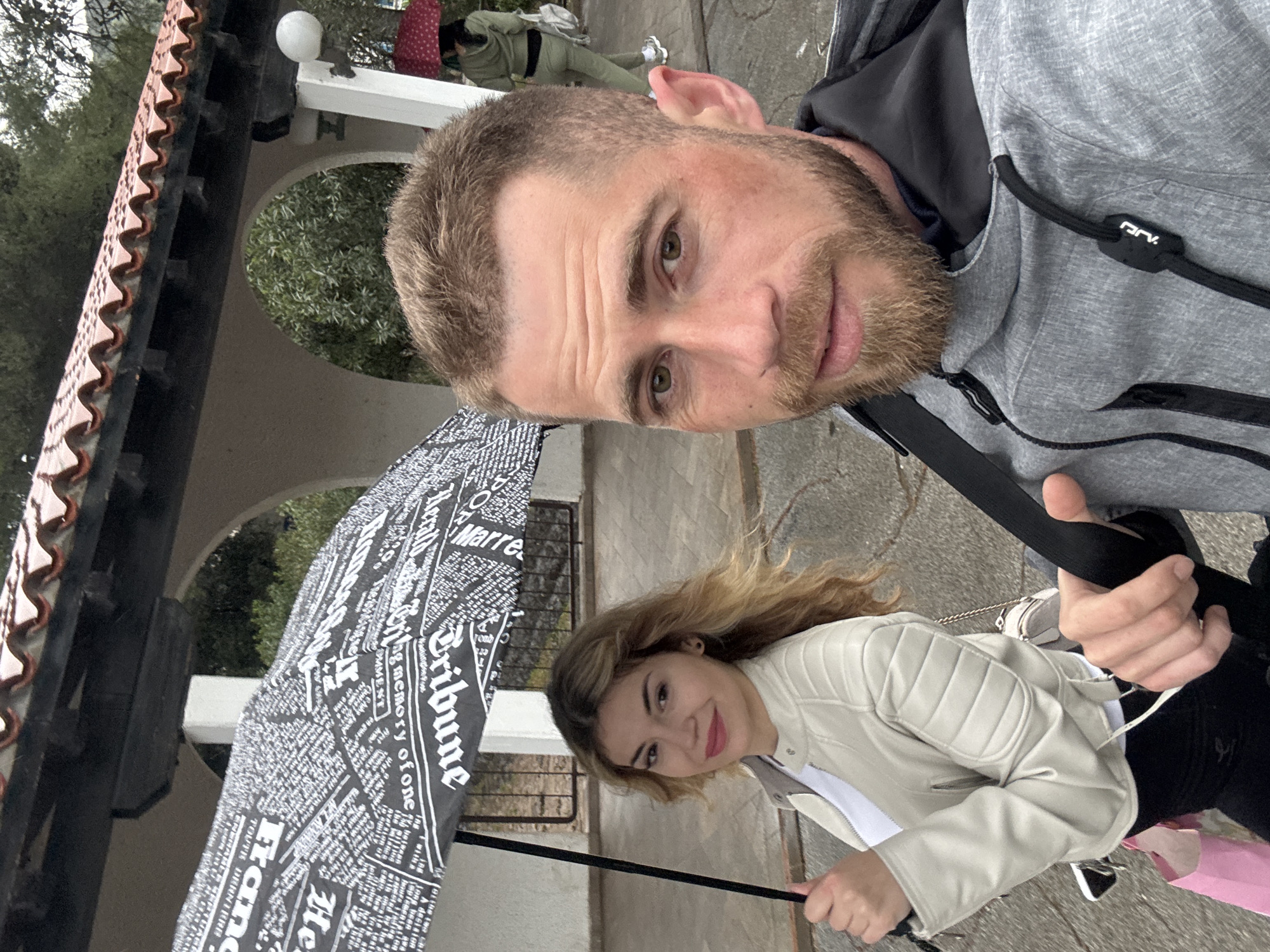 Couple documents rainy morning routine in coastal Budva