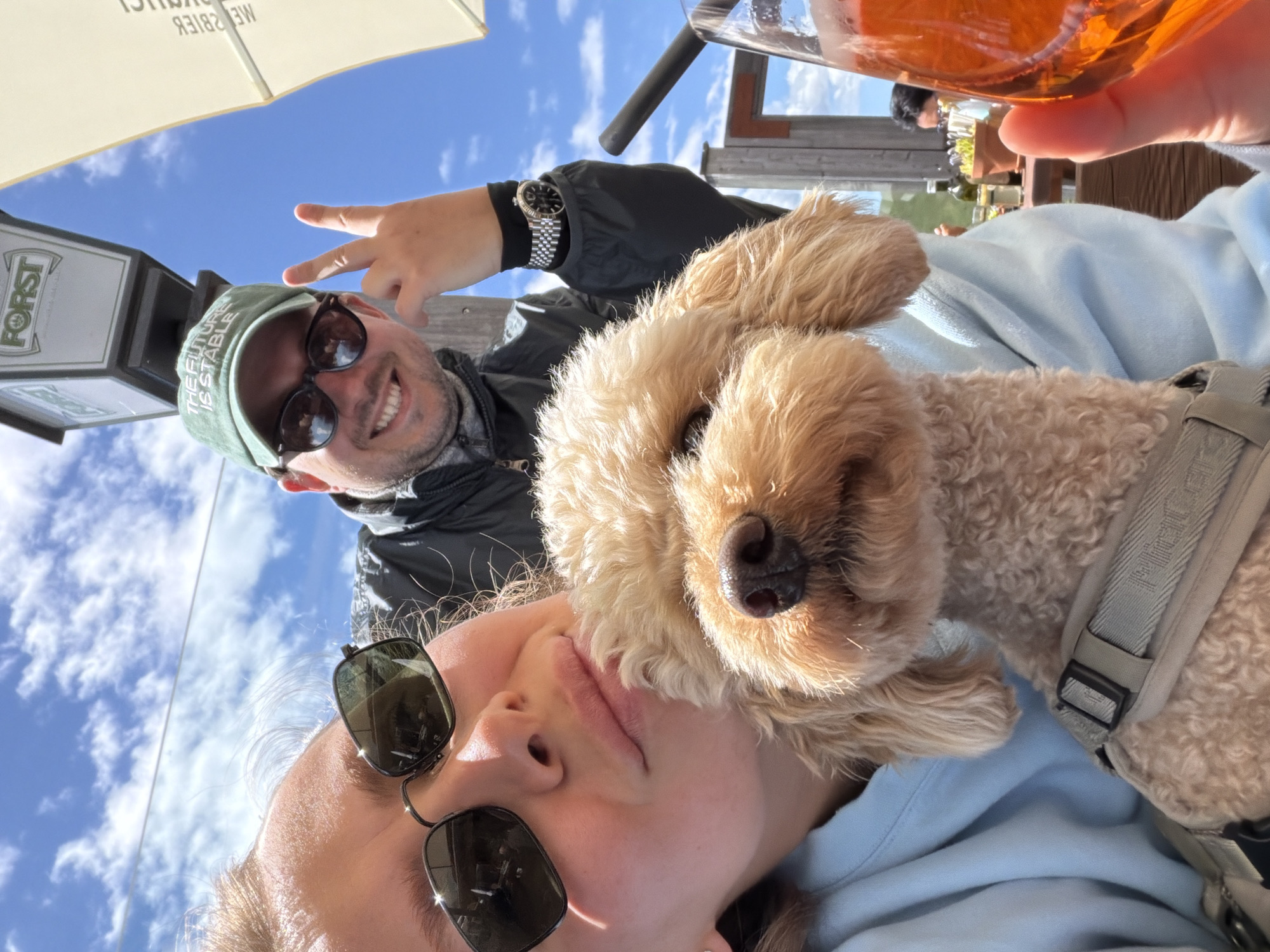 Sunny beer garden selfie with a poodle in South Tyrol