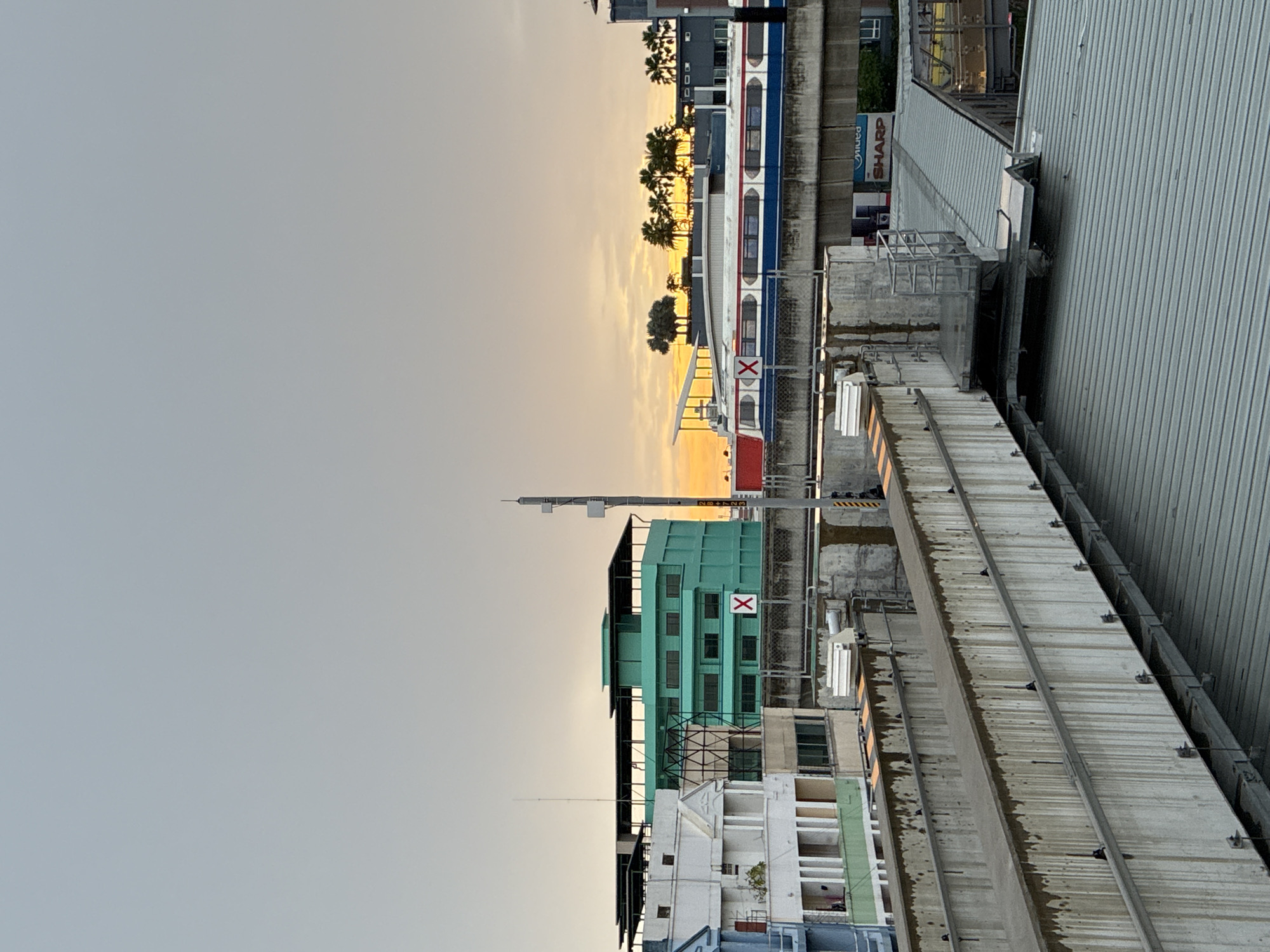 Elevated rail line at dusk in Samrong Nuea, Thailand