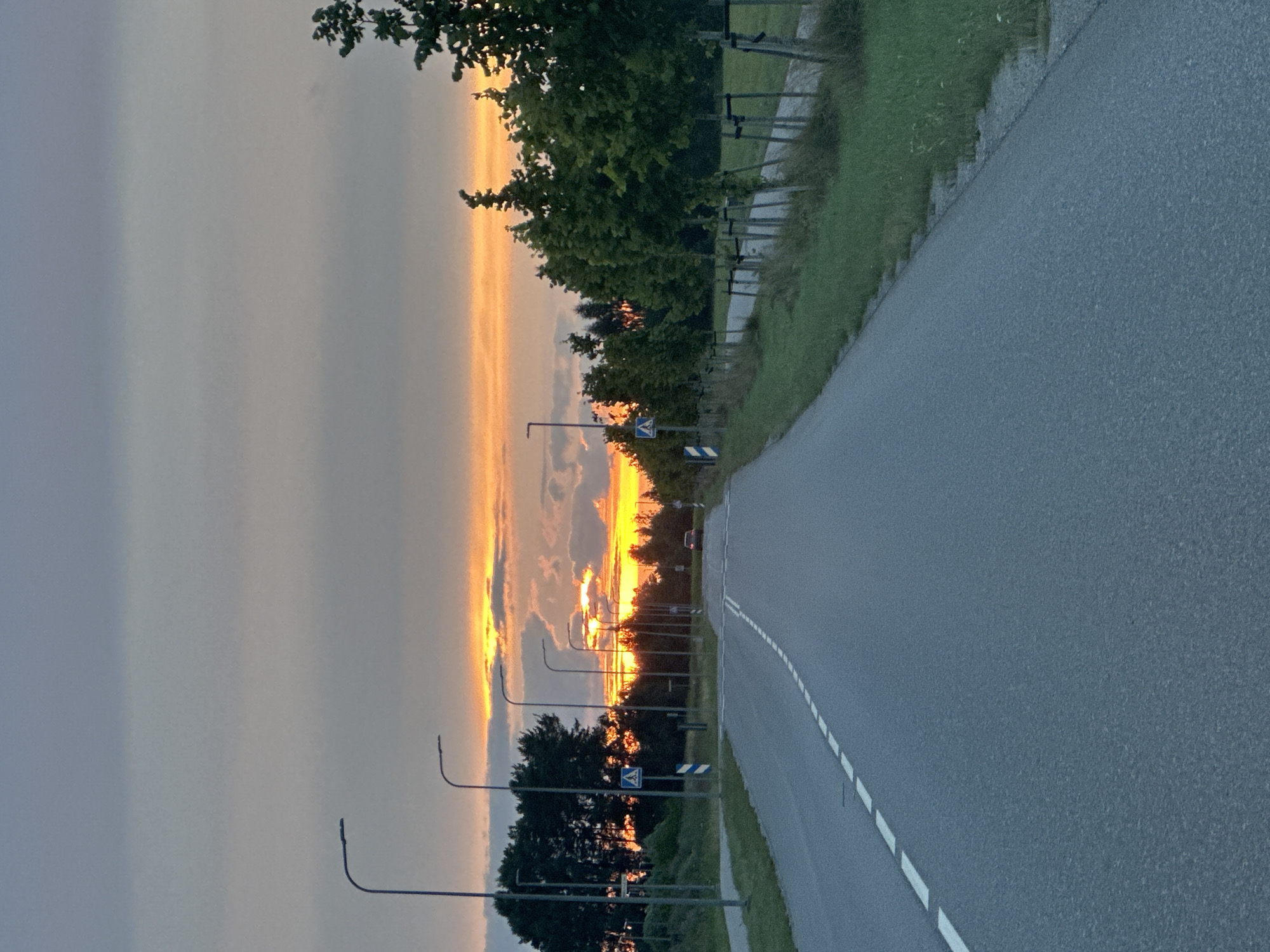 Sunset over a quiet rural road in Tiskre, Estonia