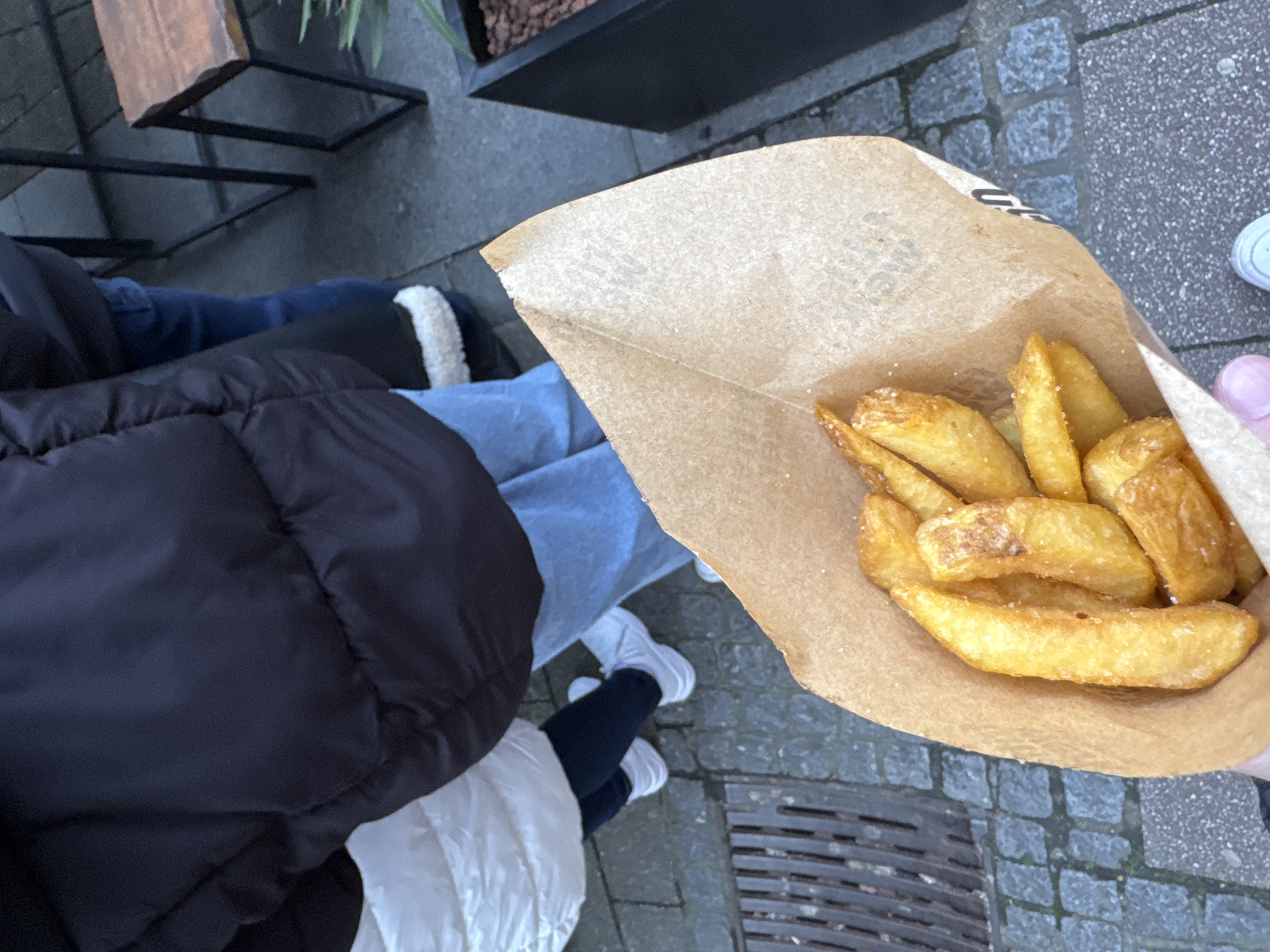Midday street life documented around Essen's Market Church square