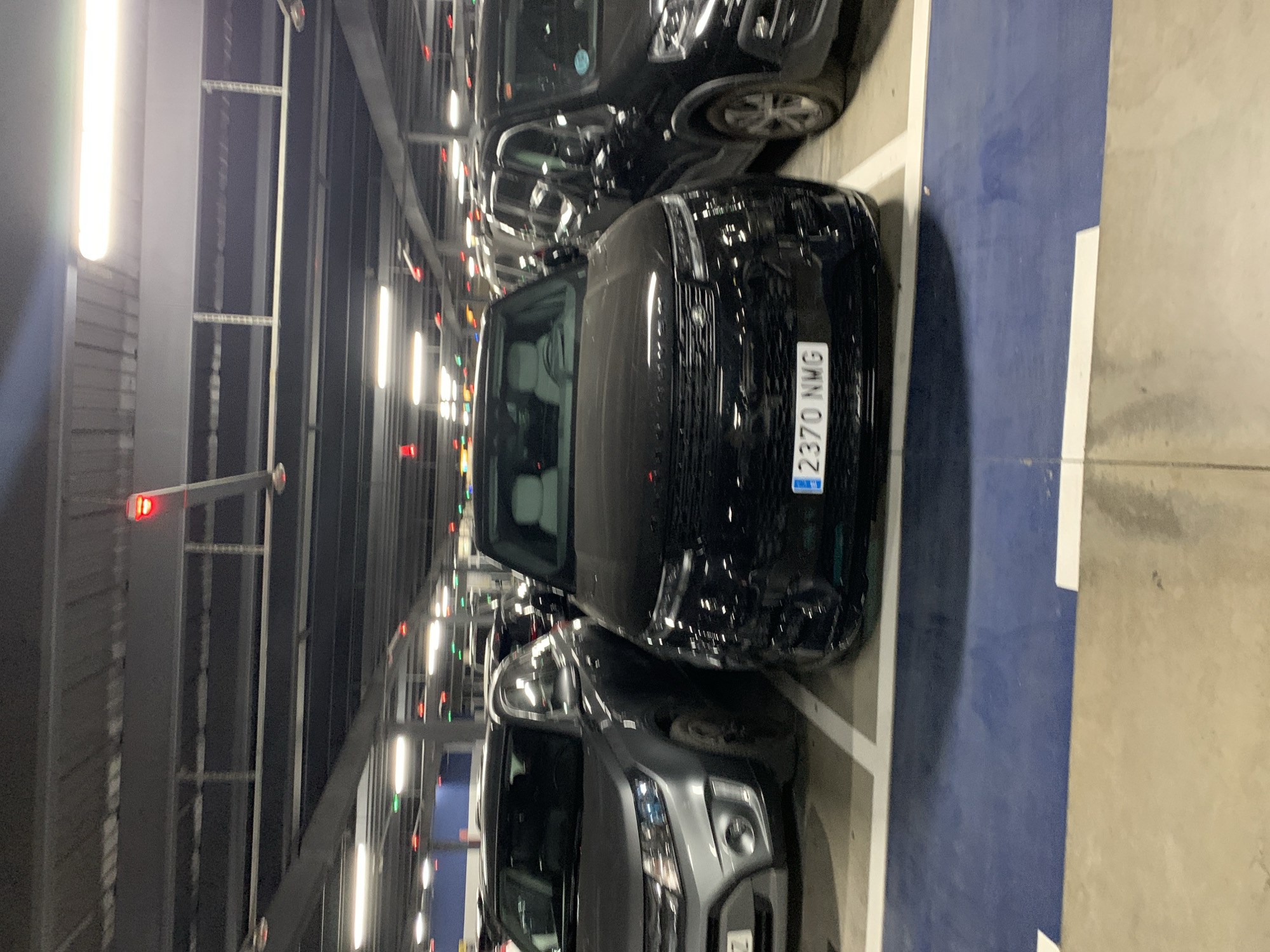 Late-night scenes from Manises Airport's parking garage and exterior