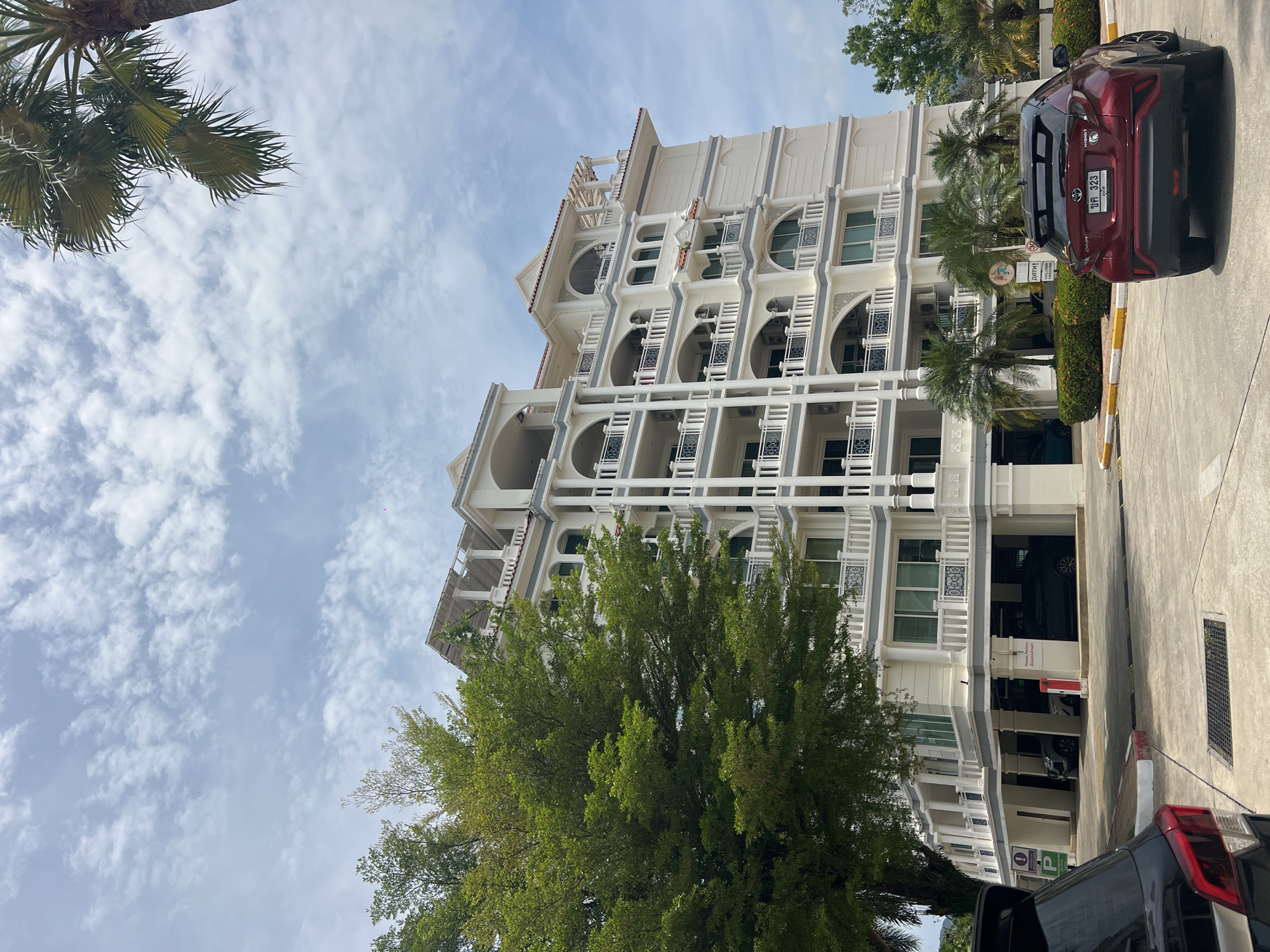 Colonial-style building with ornate balconies documented in Kathu, Thailand