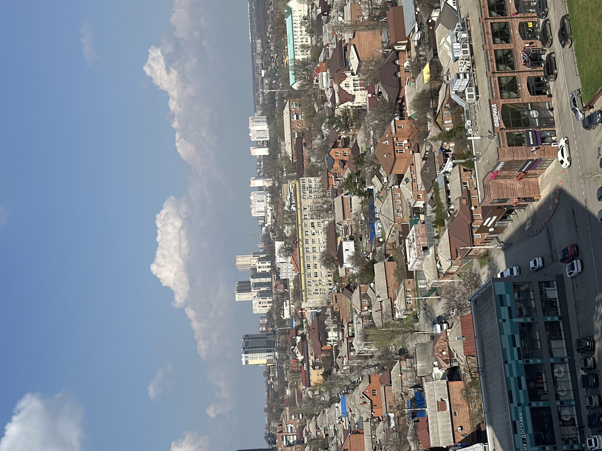 Aerial views document Novoaleksandrovka cityscape and residential buildings