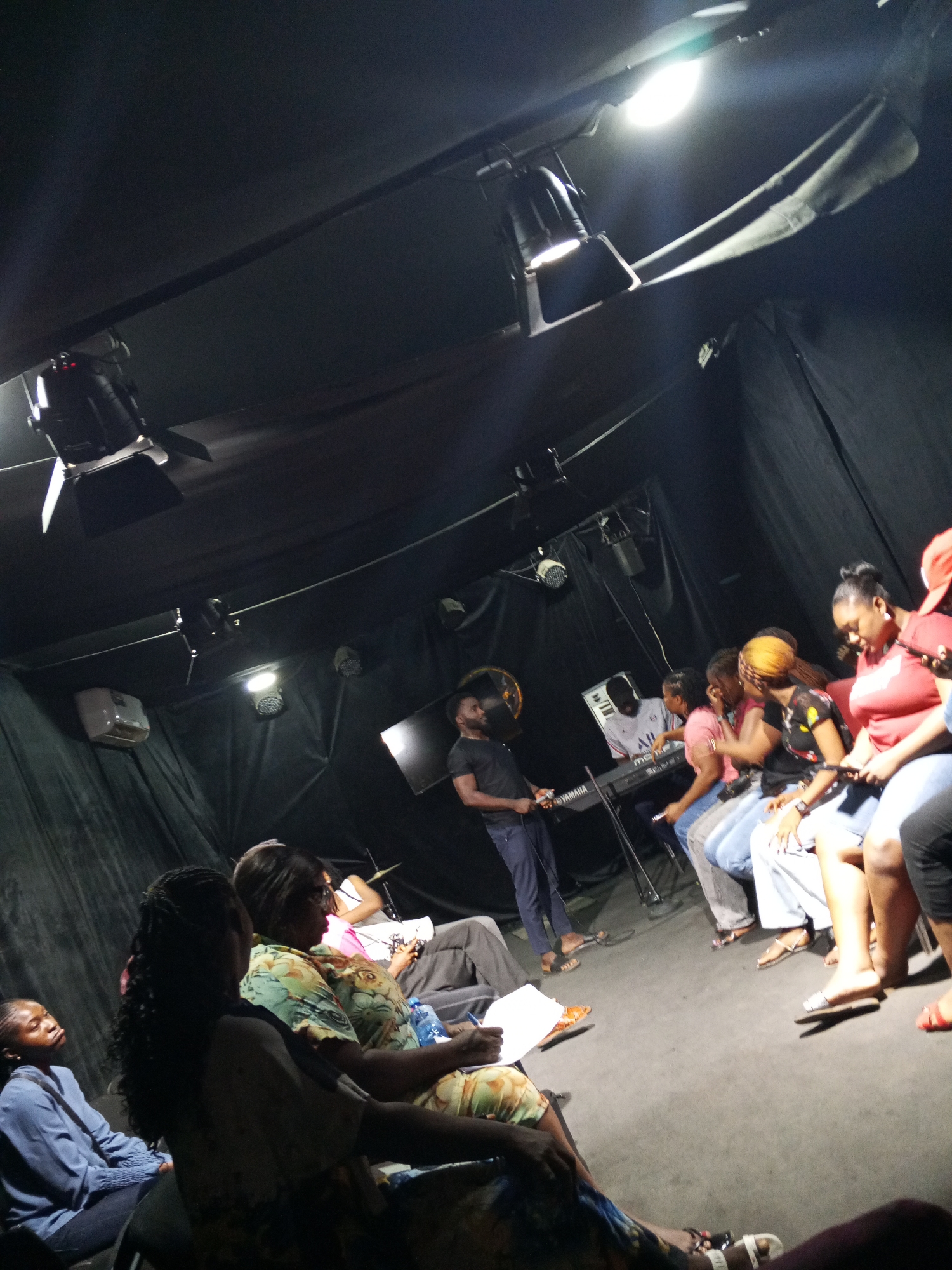 Intimate music performance captured in small Abuja theater space