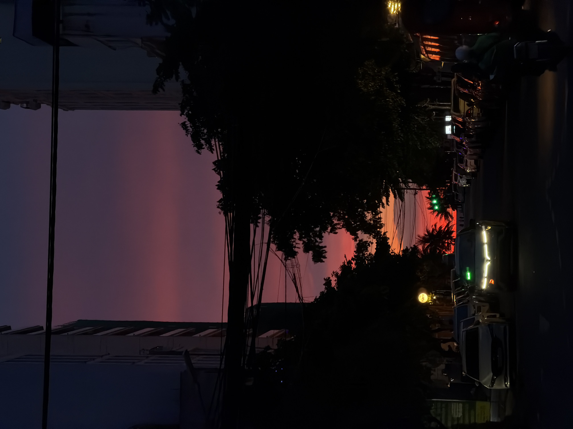 Fiery sunset sky over Đà Nẵng streets at dusk