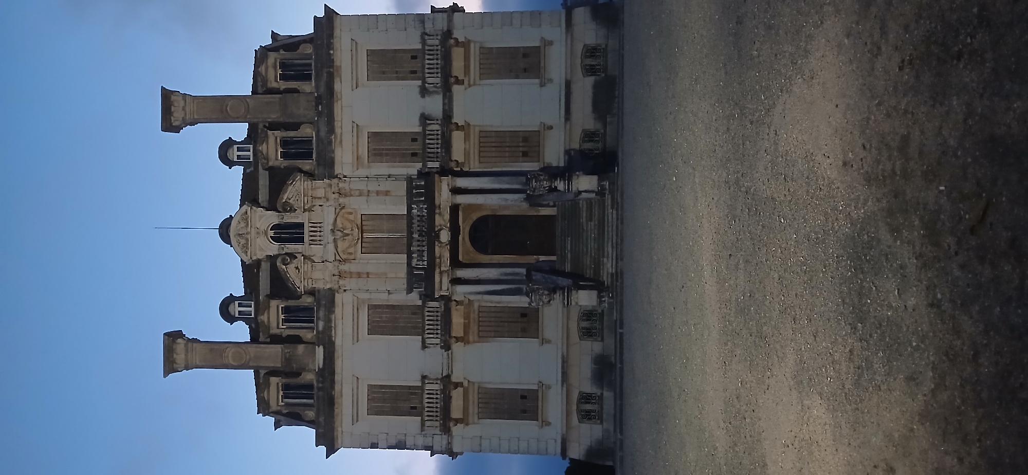 Abandoned ornate three-story building documented in disrepair