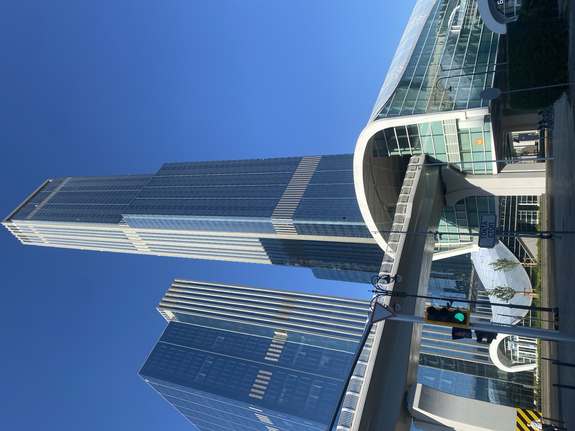 Street-level moments around a modern glass skyscraper district