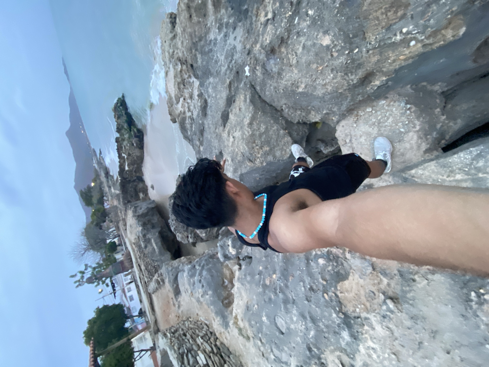 Man visits Juan Griego coastline during cloudy weather