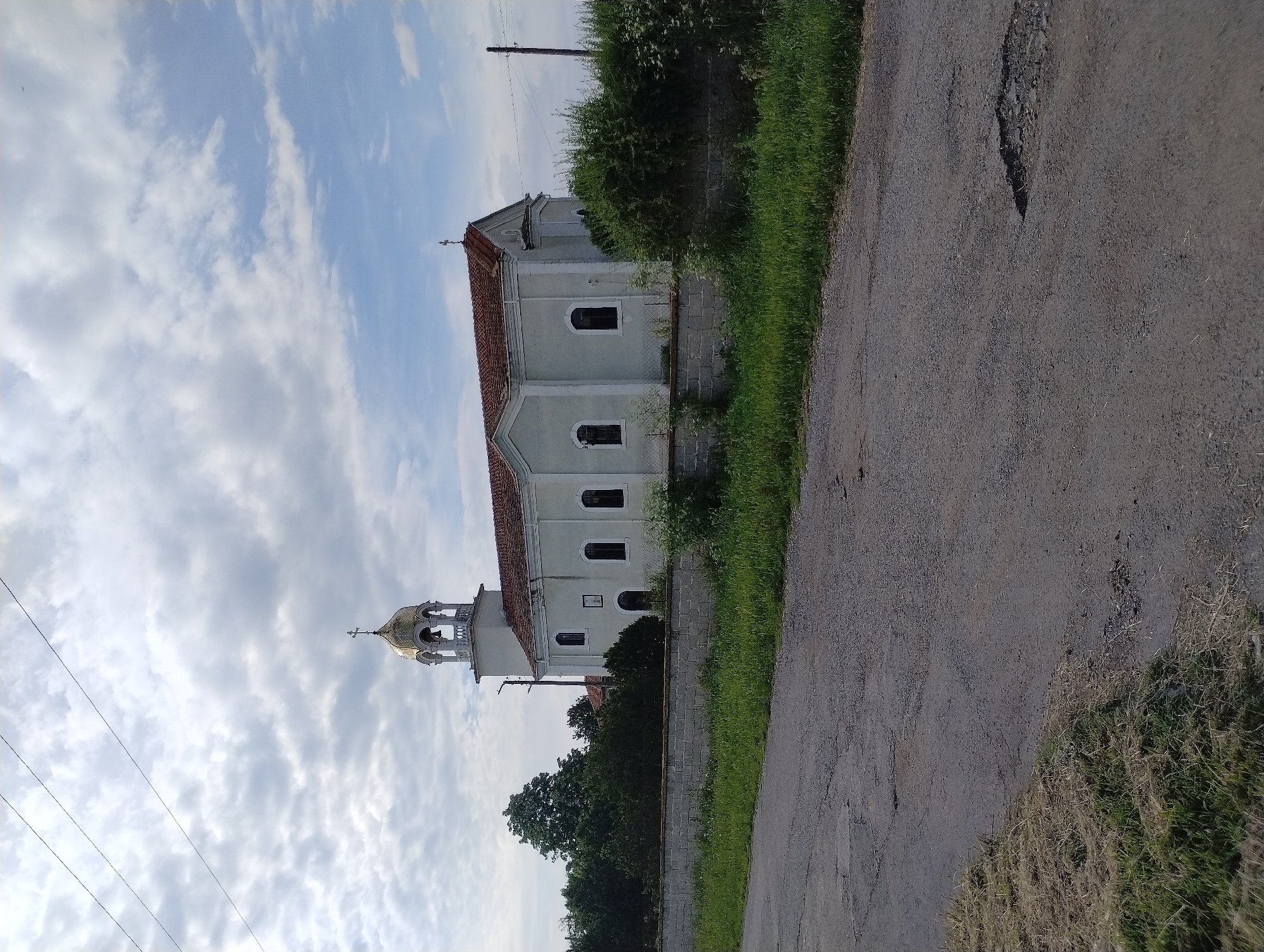 Tourist captures church and roses in Roza, Bulgaria