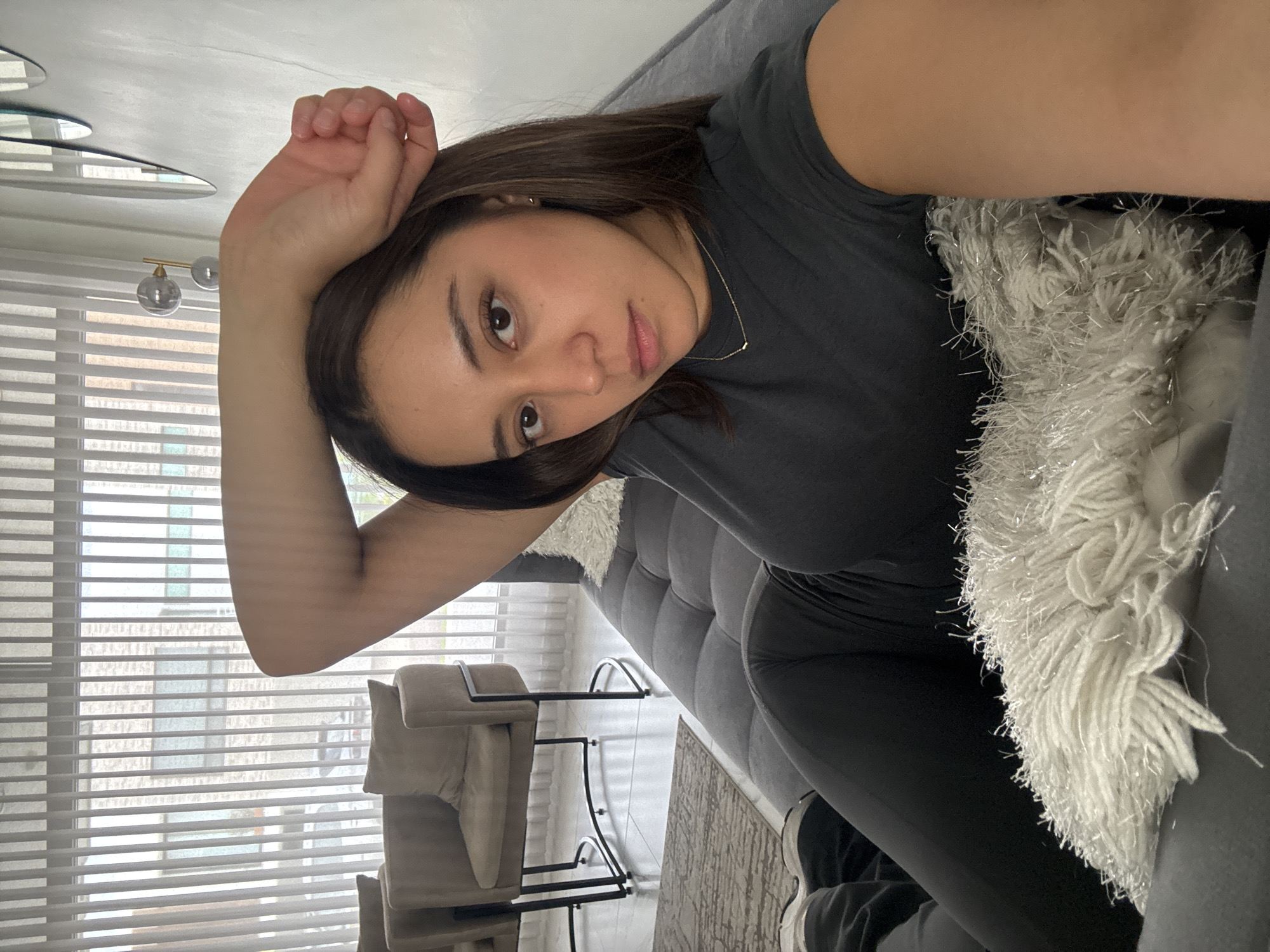 Chilling on a gray sofa in Puebla