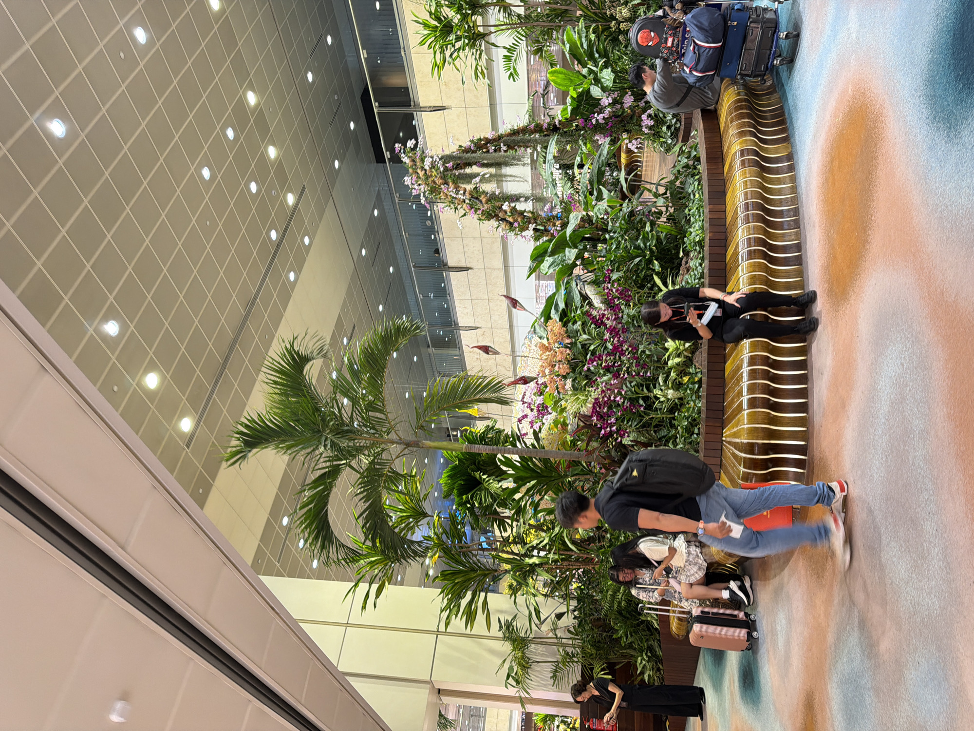 Exploring Jewel Changi Airport's gardens, waterfall, and retail spaces