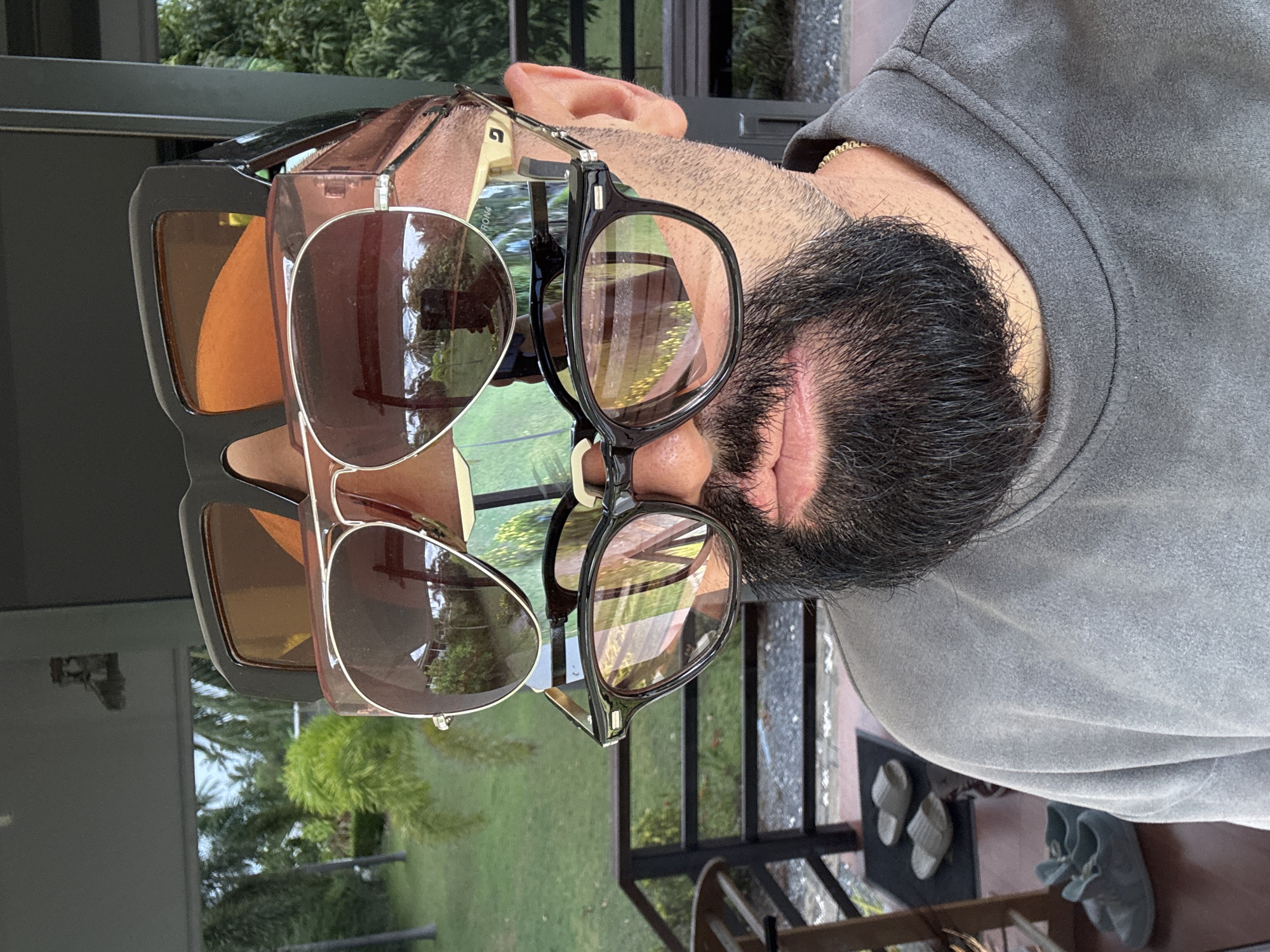 Stacking sunglasses in Ko Samui's tropical greenery