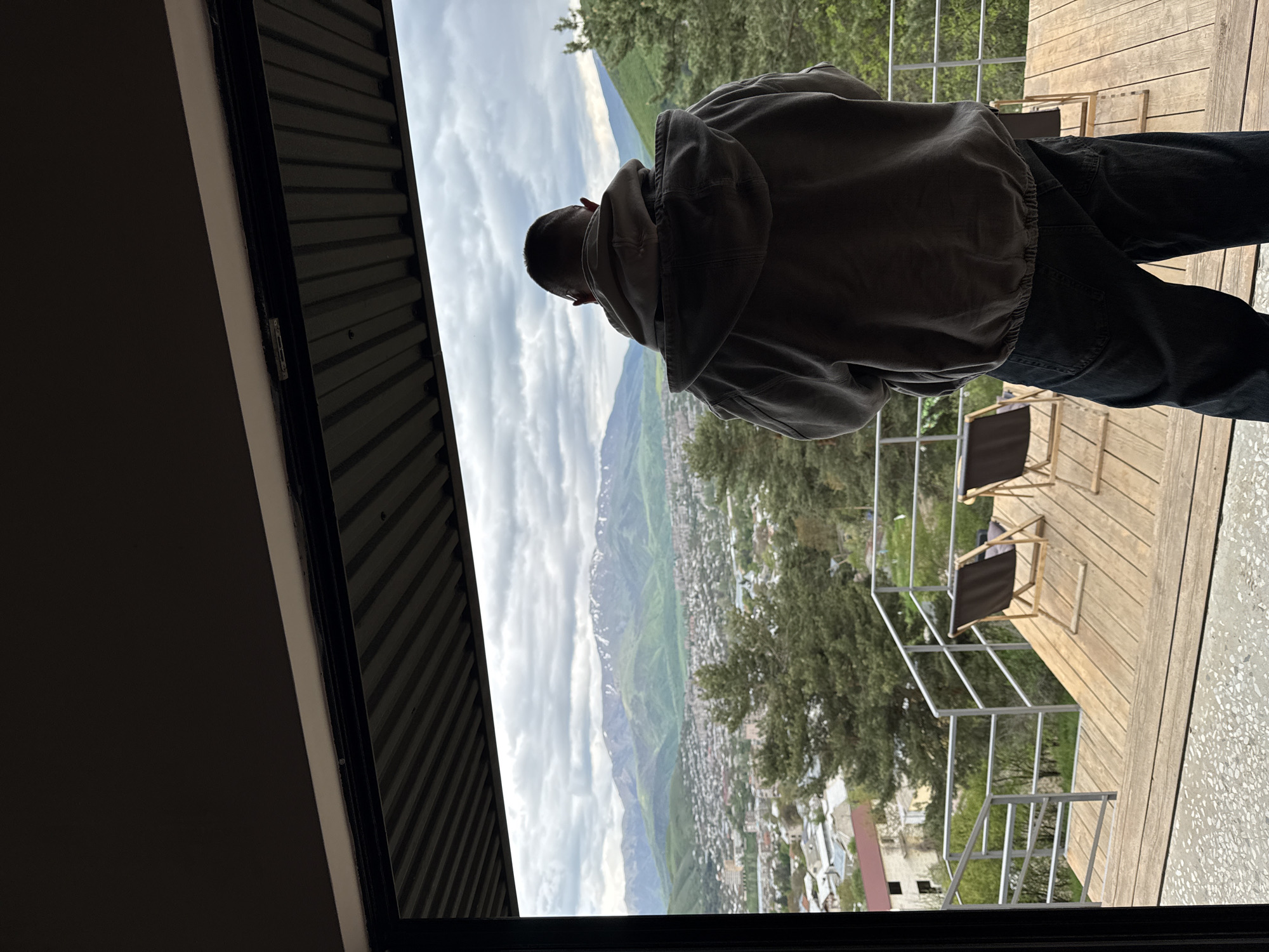 Person visits art gallery with mountain views in Vanadzor