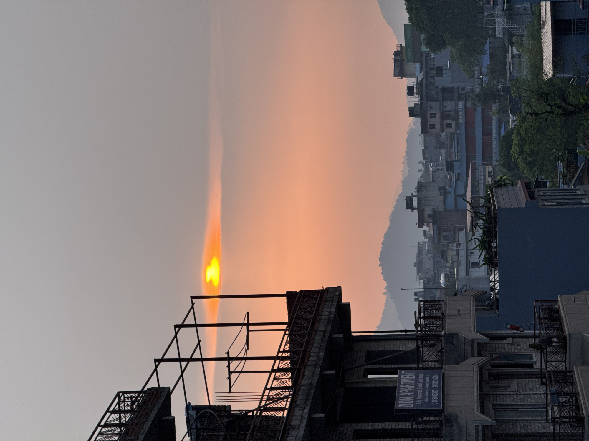 Sunset documented over Pokhara cityscape in Nepal