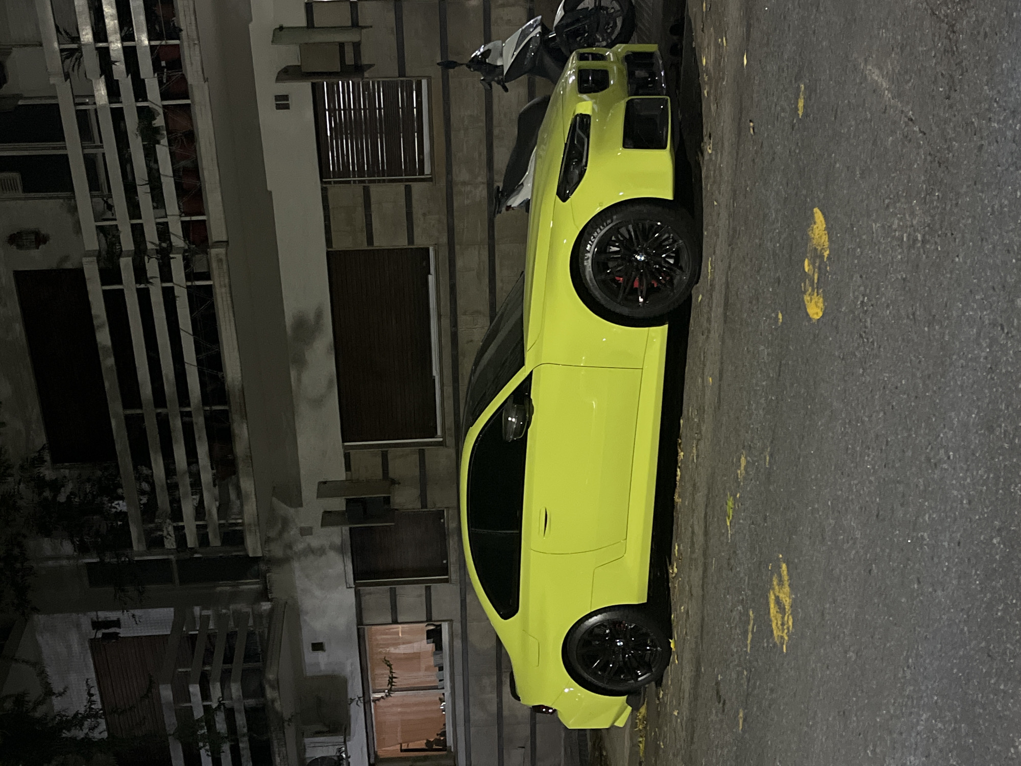 Bright Corvette spotted on wet Buenos Aires street