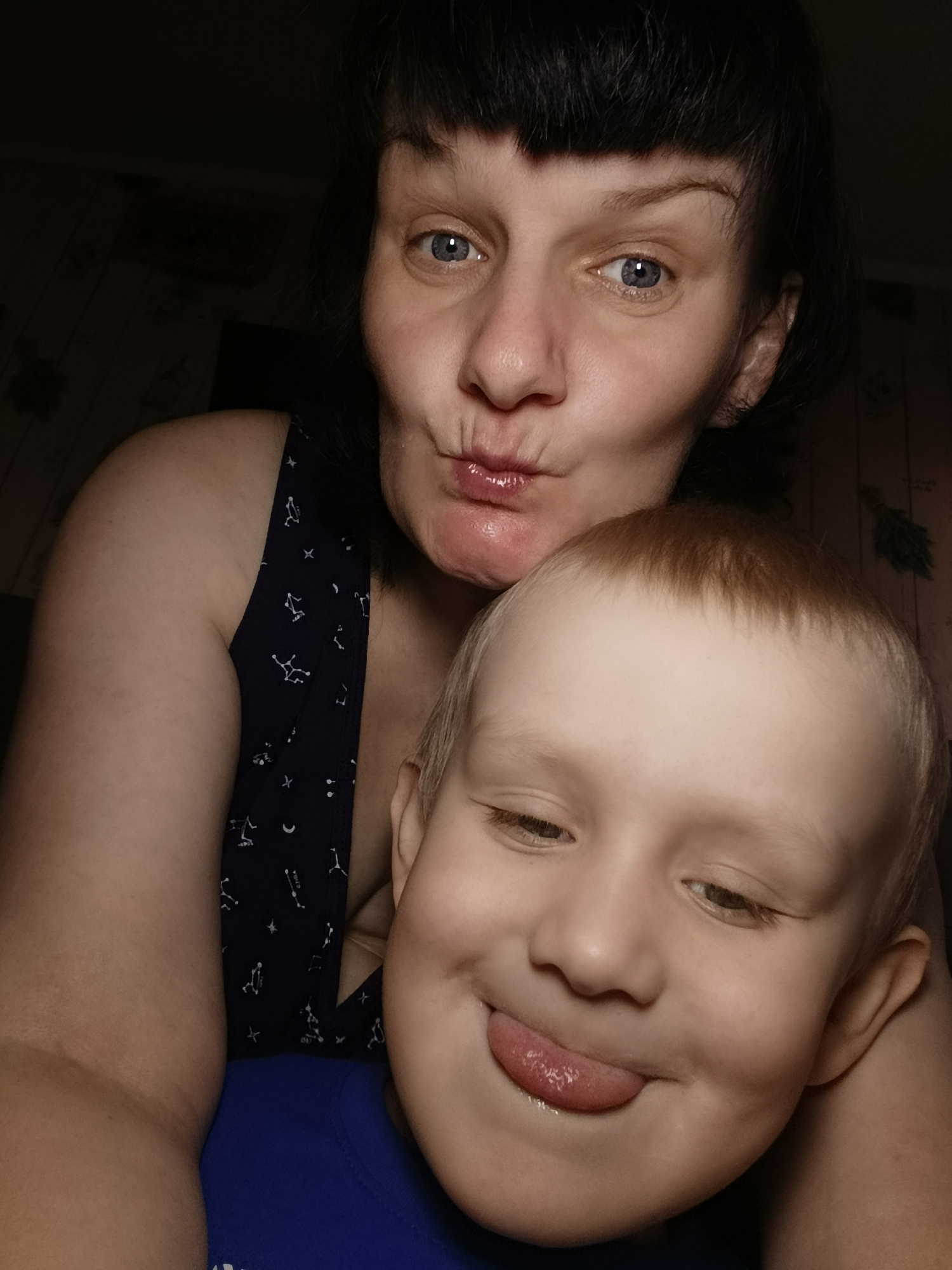 Woman and child share playful moments indoors
