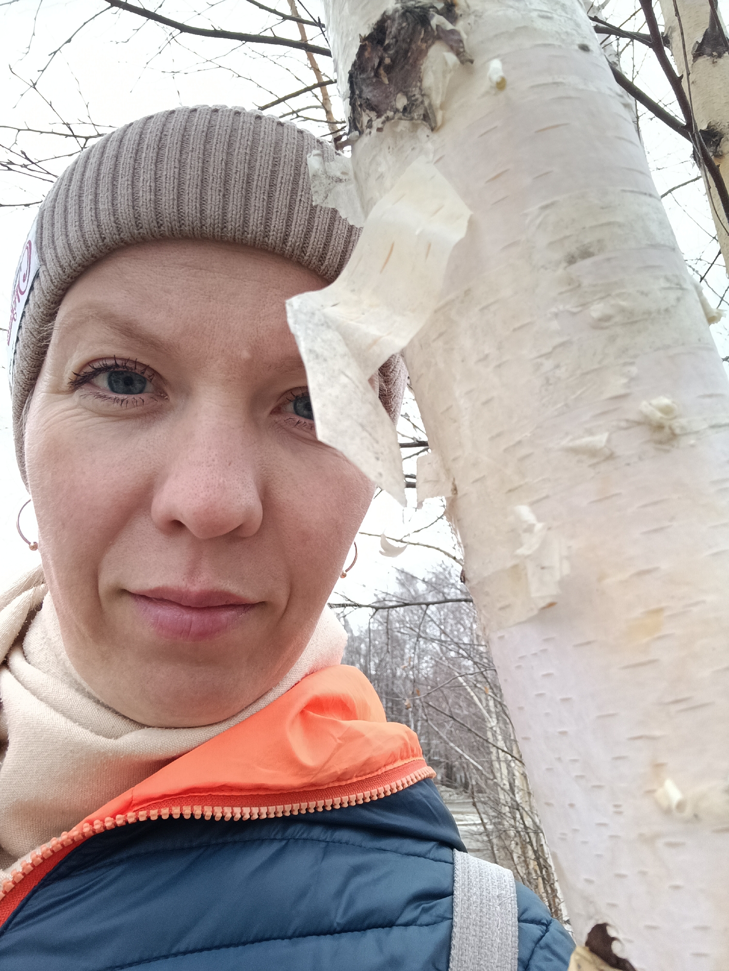 Woman takes playful car selfies in snowy Chaikovsky
