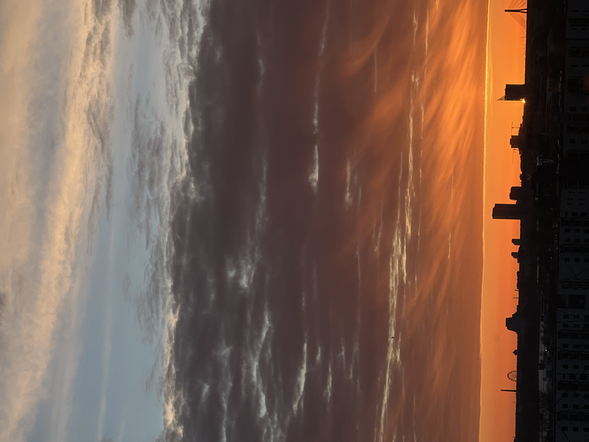 Dramatic sunset displays vibrant colors over Riga, Latvia