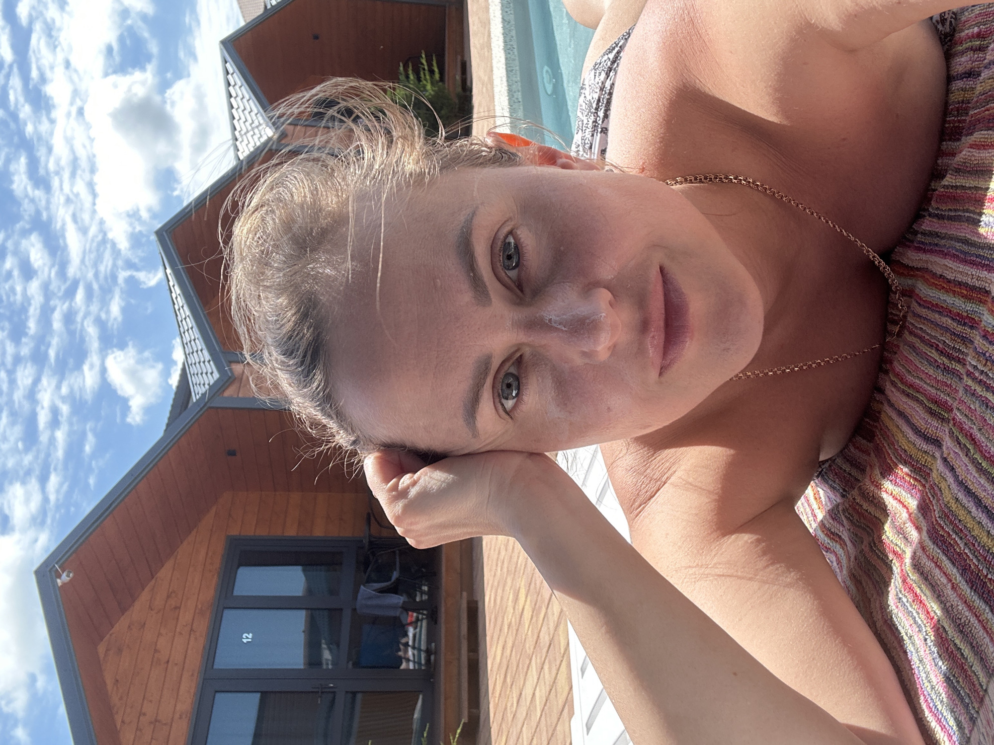 Poolside morning at a wooden cabin resort in Anapa