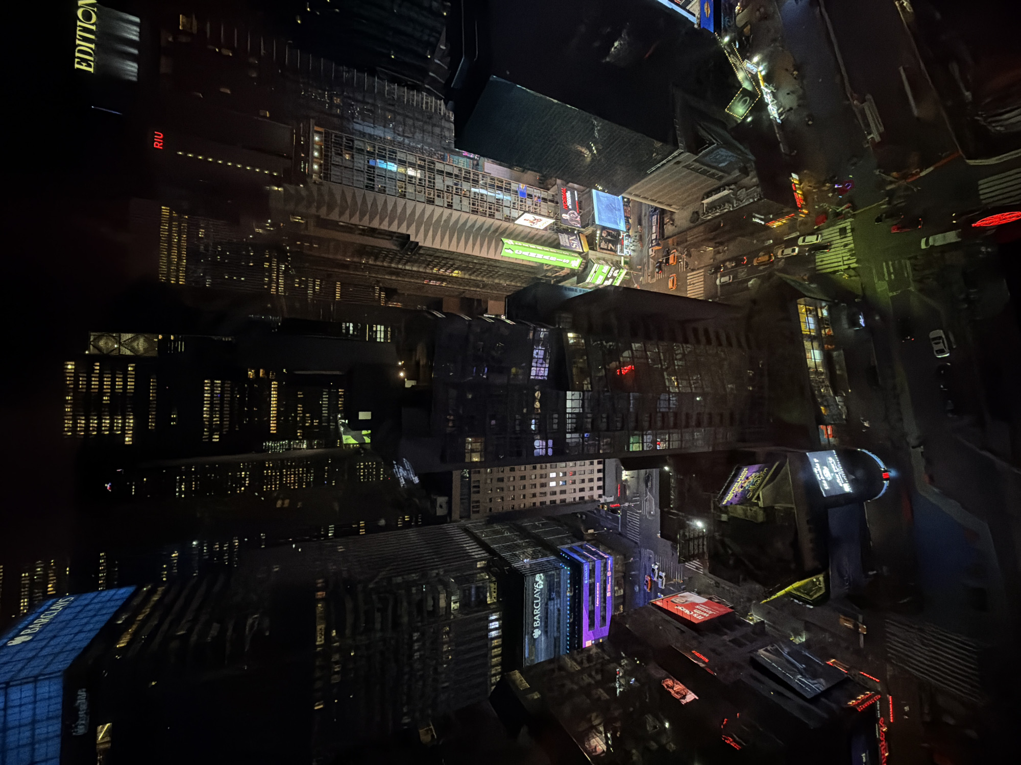 Aerial night view of illuminated Times Square captured